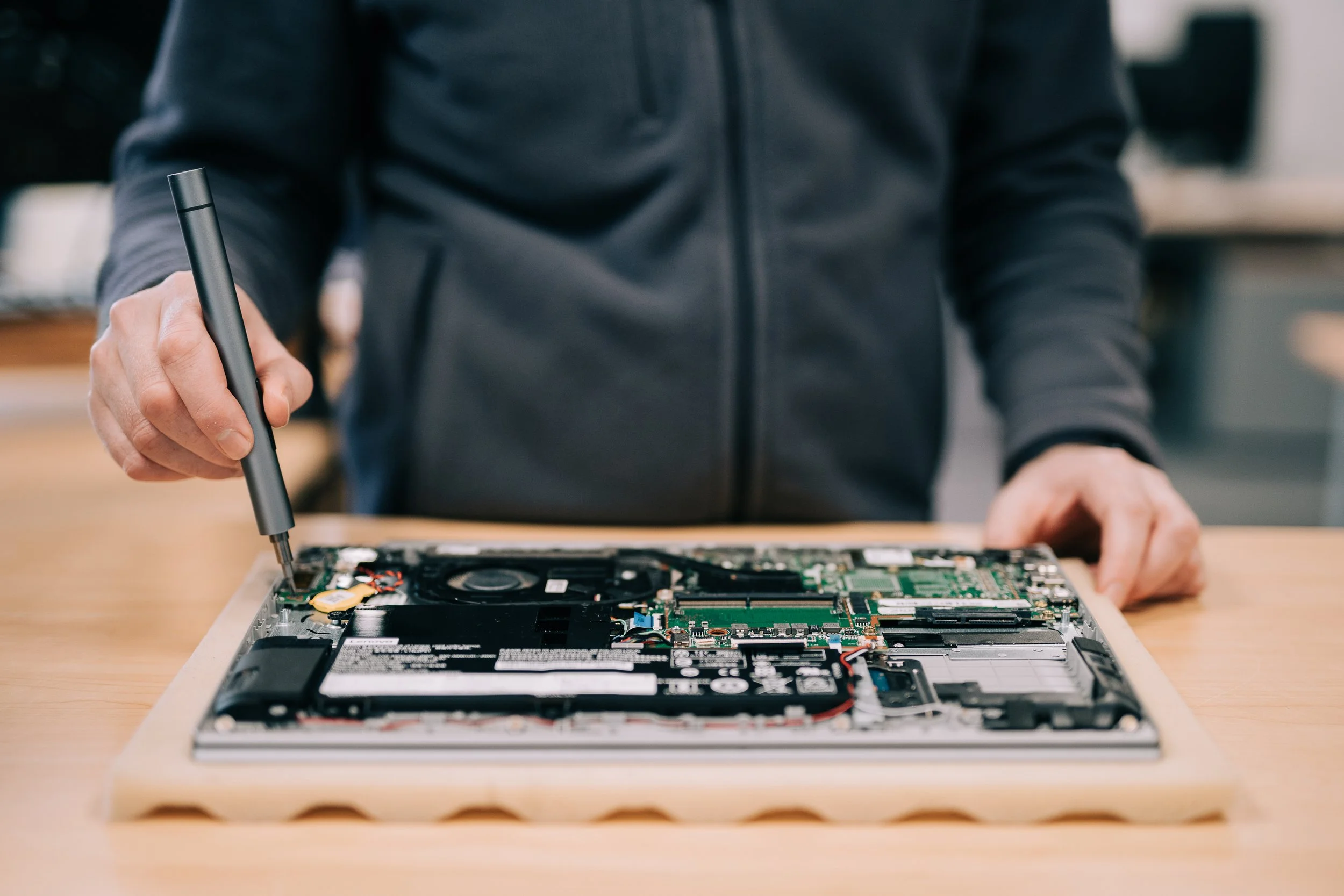 mels computer care stood fixing a laptop