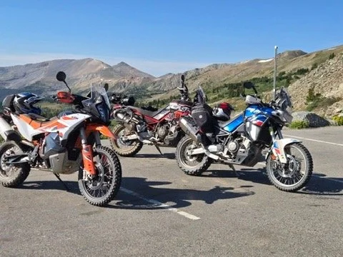 Colorado motorcycle tour riding through high mountain pass