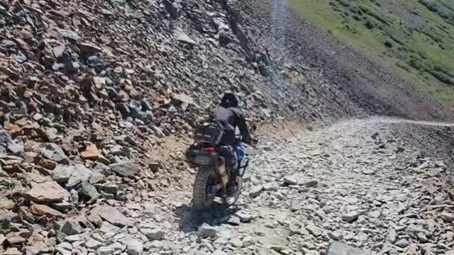 Colorado motorcycle tour riding through high mountain pass