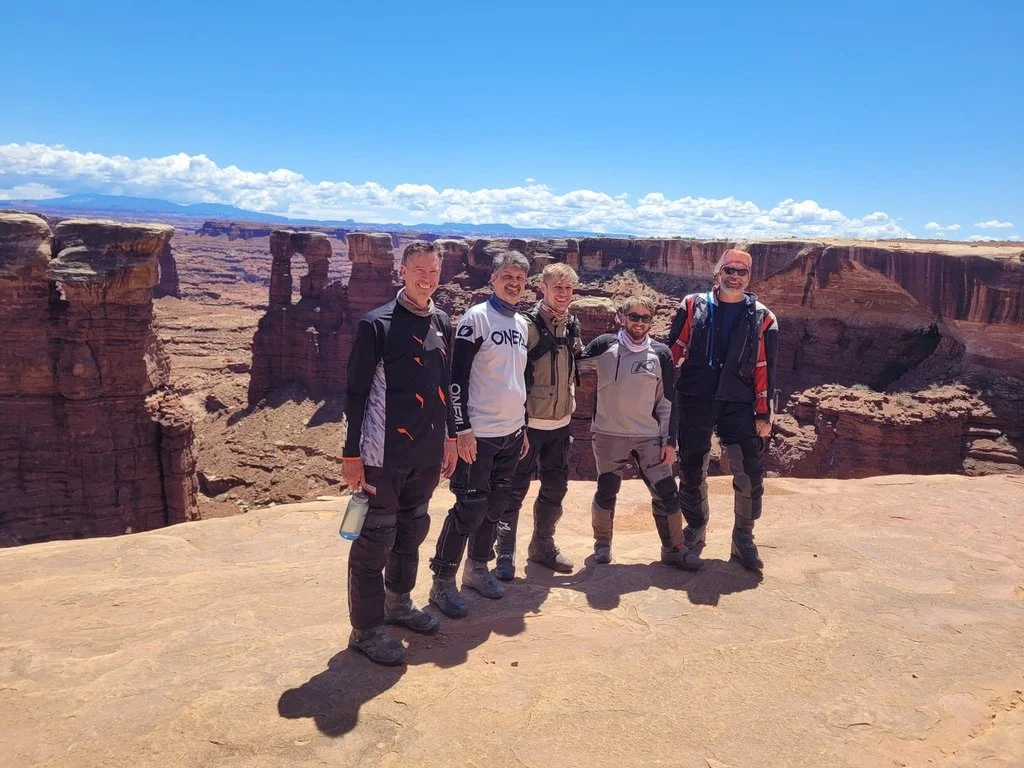 Utah motorcycle tour riding through red-rock desert terrain
