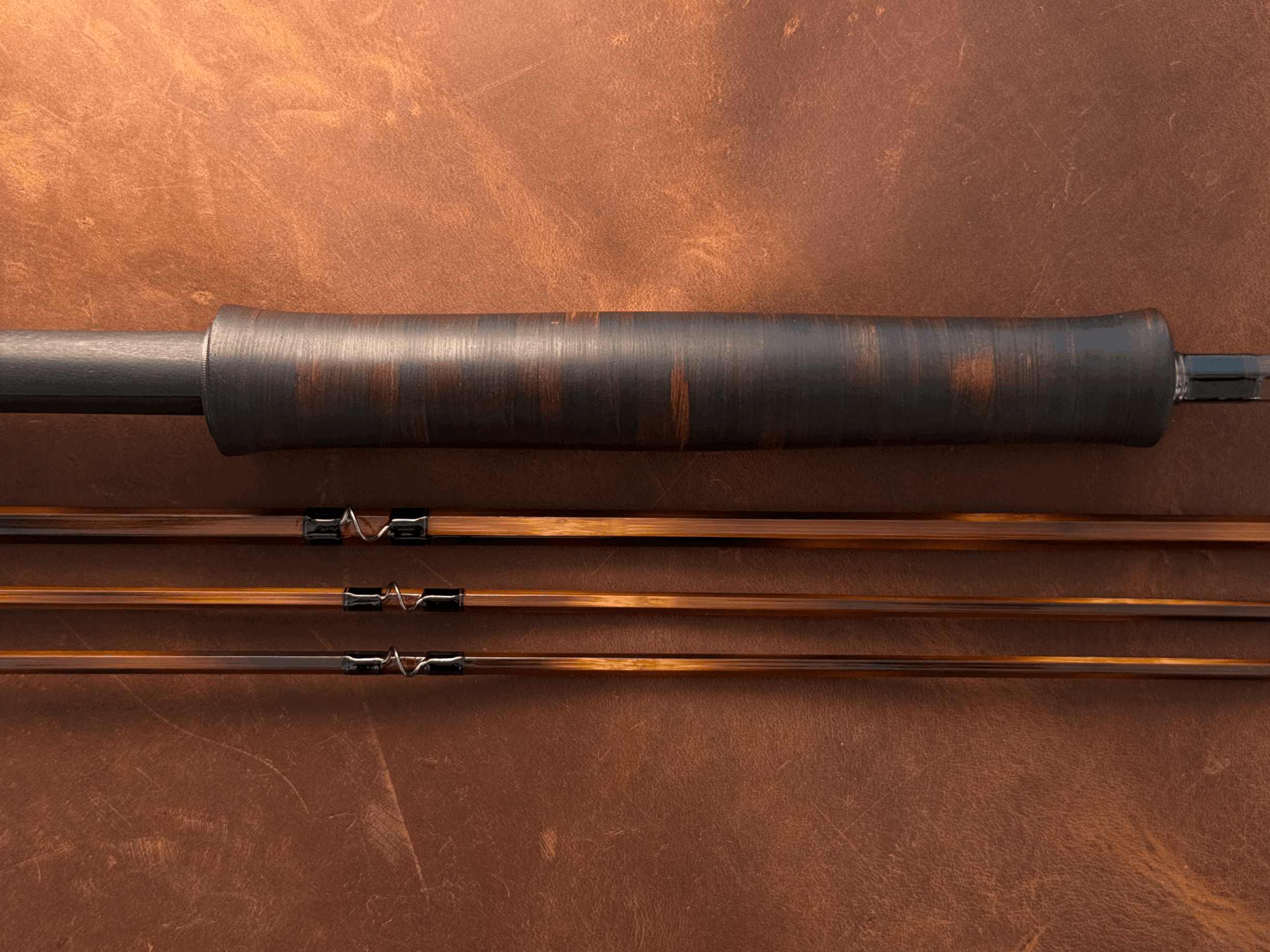 Grip of rod made of ebonized cottonwood bark.