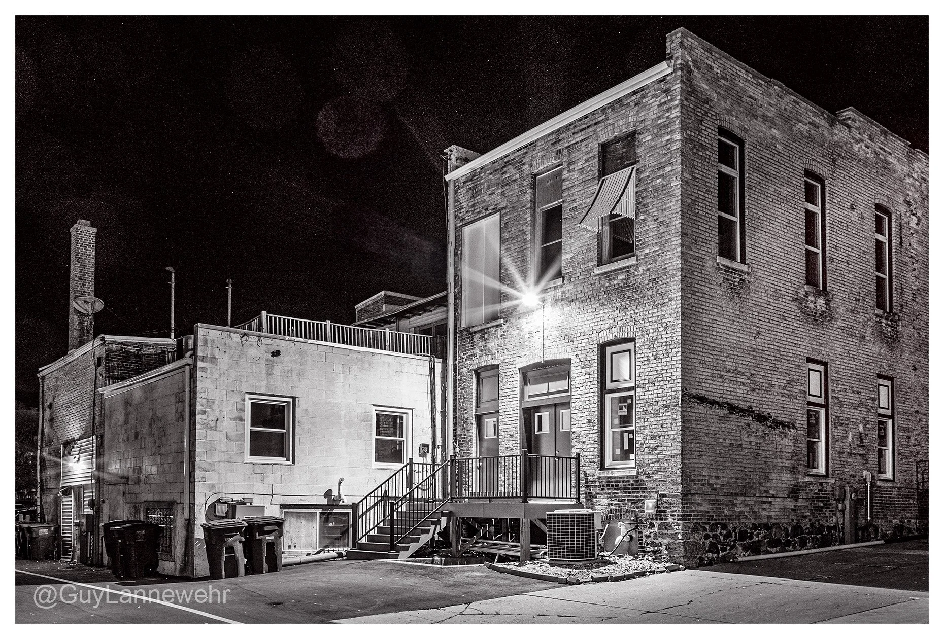 Down one of the back alleys at night with my camera.

#BWPhotography #NightPhotography #CityAtNight #UrbanNoir #NightStreets #ThroughMyLens #JeffersonWI