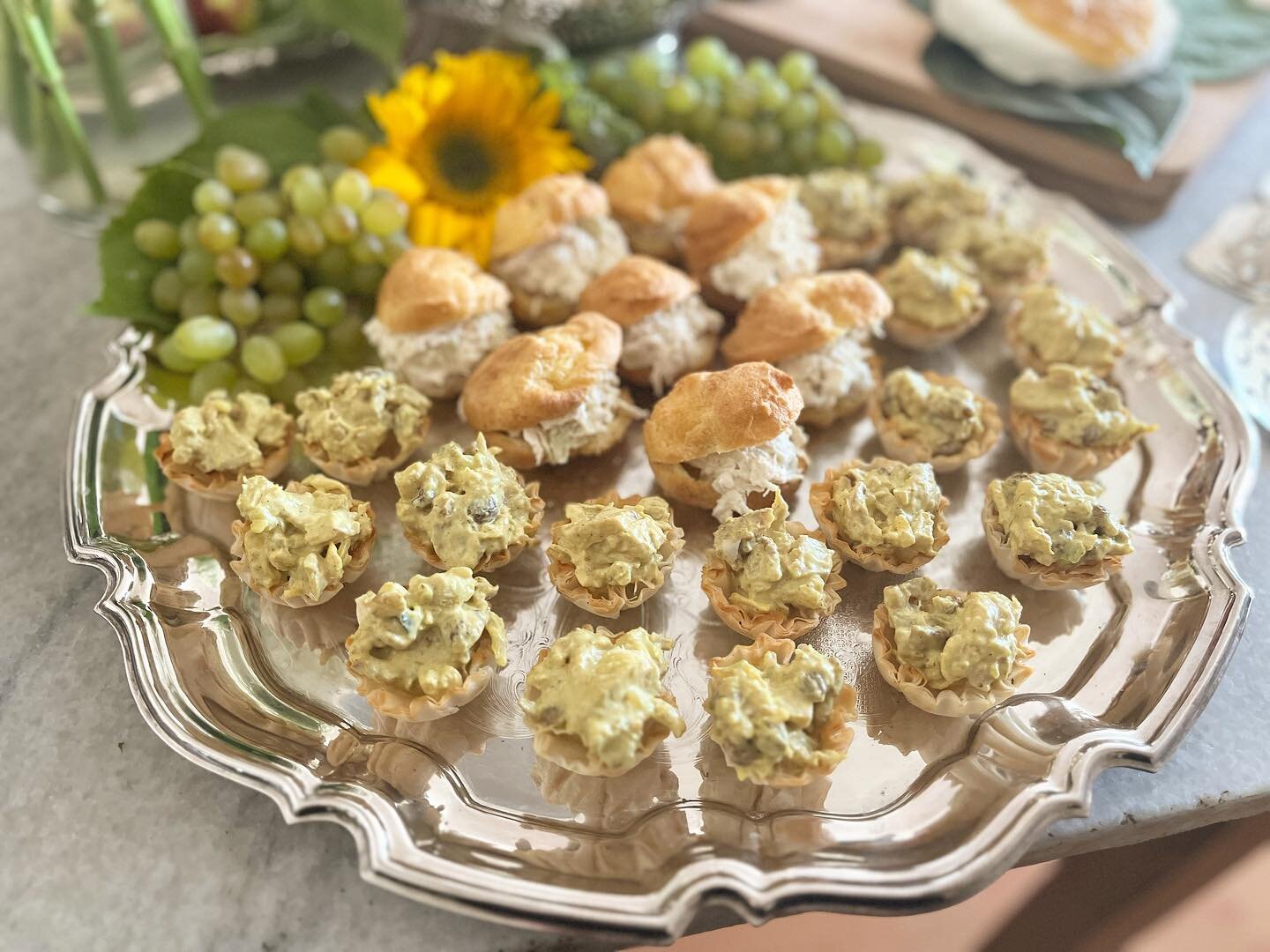 A sweet sip and see with coronation chicken salad cups, southern chicken salad puffs, assorted appetizers, a fruit and chocolate board and bubbly to toast the bouncing baby girl #sipandsee #partybeeevents