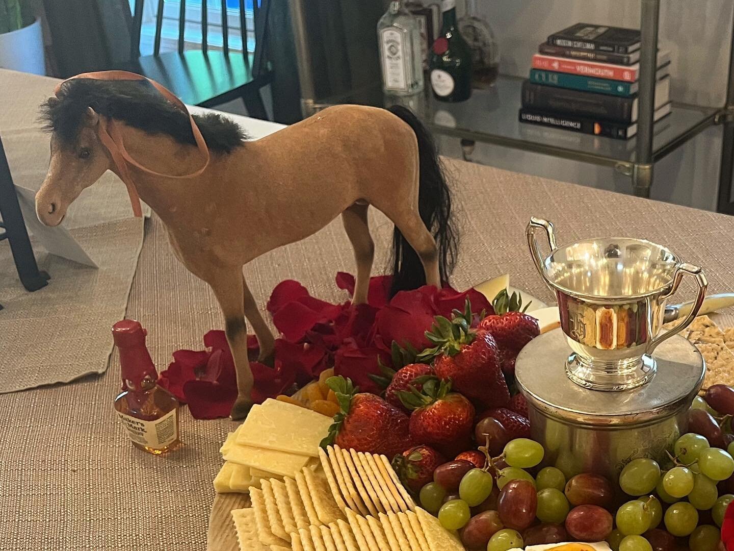 Giddy up!  This Derby Day party was a hit with the addition of Kentucky Bourbon Balls, Hot Browns and Benedictine Sandwiches. Little horses galloped across the buffet and bar along with red roses, silver &ldquo;trophies&rdquo; and plenty of bourbon a