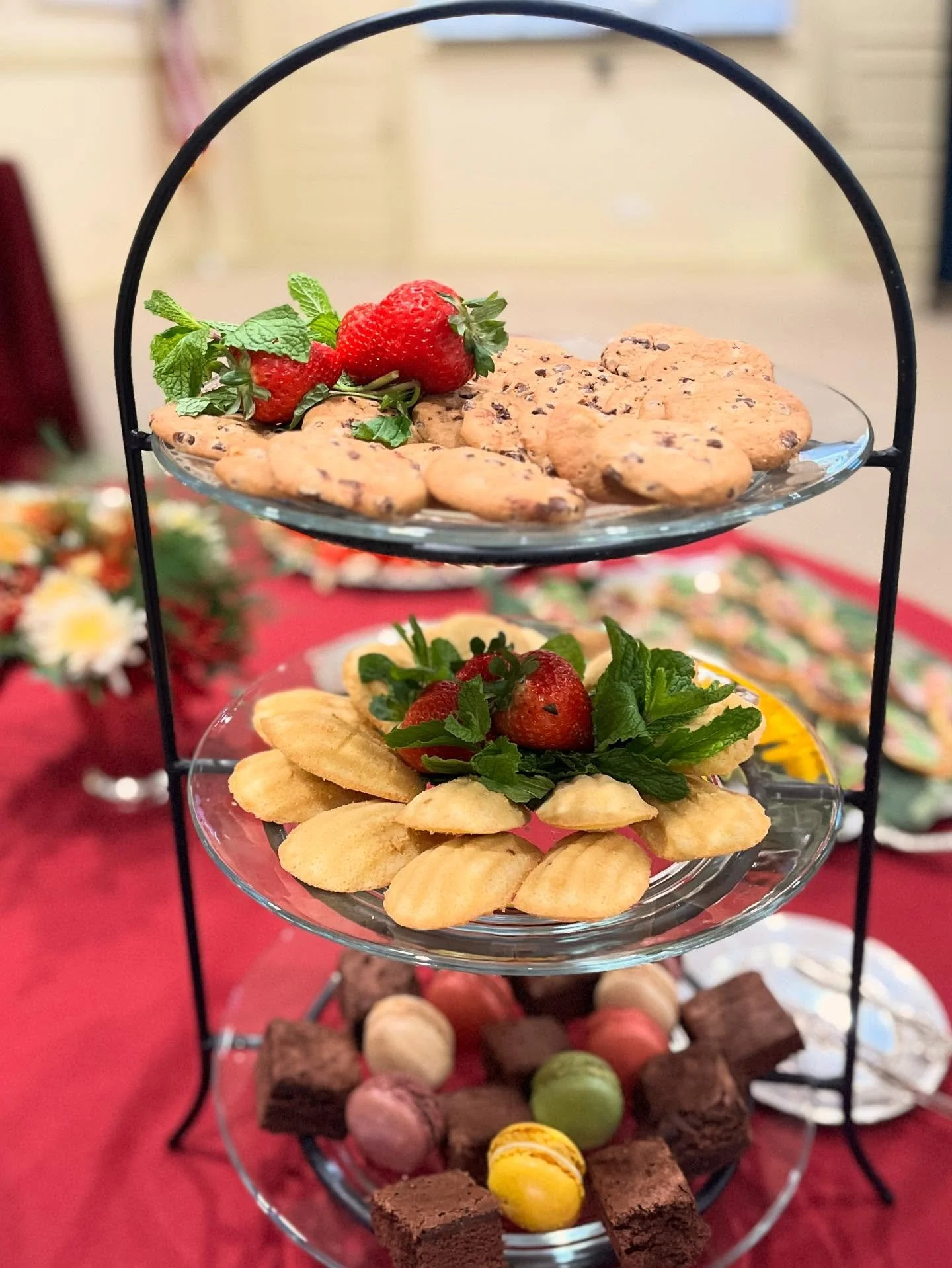 Sweets tower with a little something for everyone: mini chocolate chips, madelines, brownies and gluten free offerings of macrons and fresh fruit.