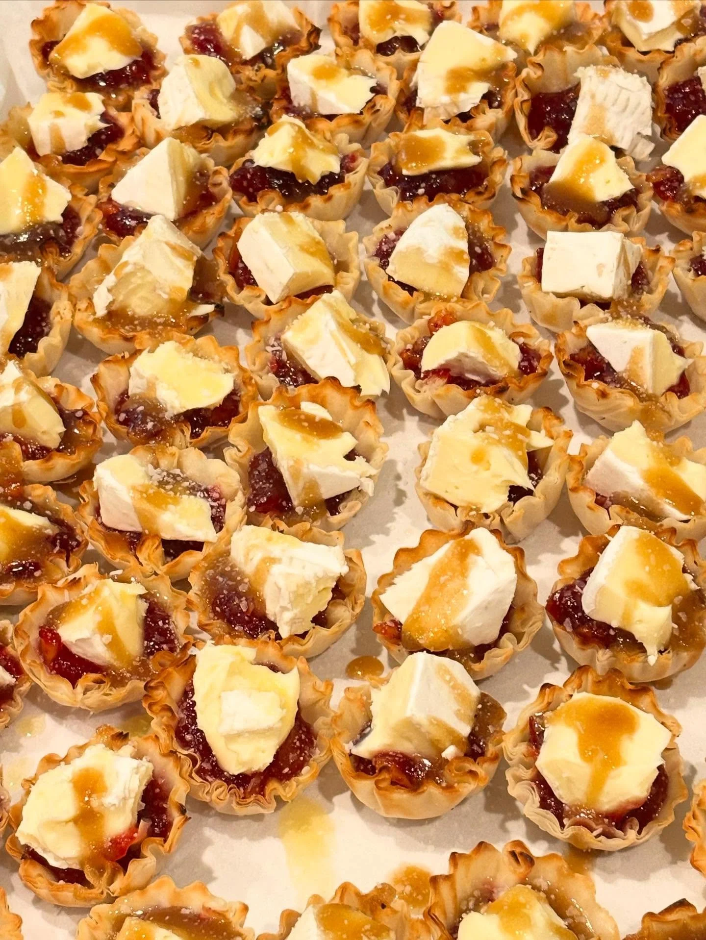 Salted caramel cranberry orange brie bites in mini filo cups - bring on the Thanksgiving day nibbles!