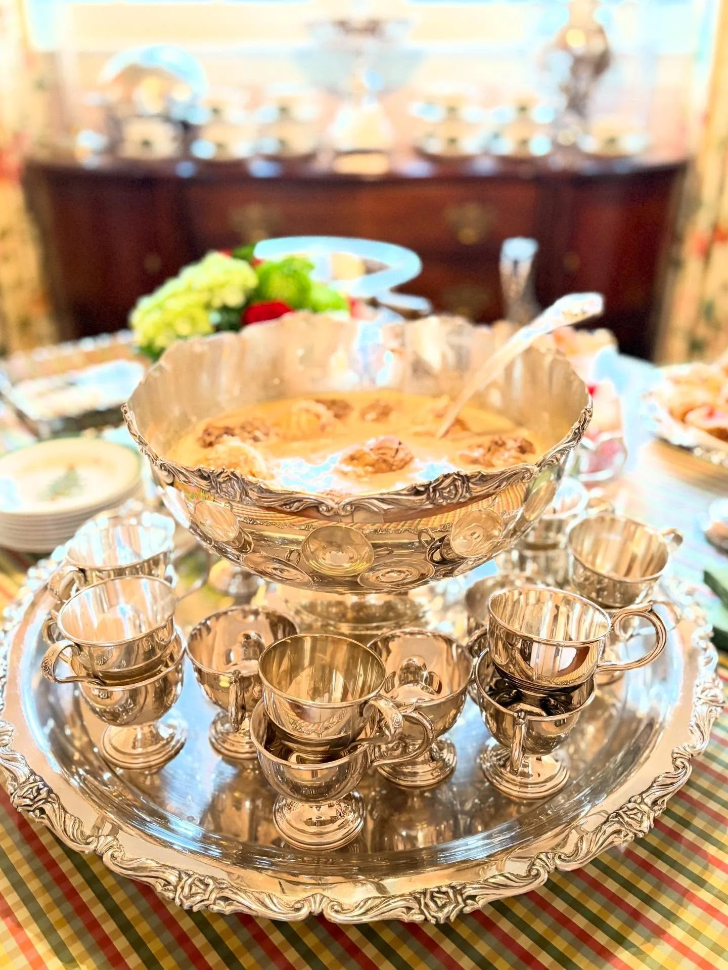 Nothing says a party like a punch bowl.  This one is filled with Coffee Punch which is a delightfully sweet mix of espresso, cream, and sugar with floating scoops of chocolate and vanilla ice cream.  Like an ice ring the ice cream keeps the punch col