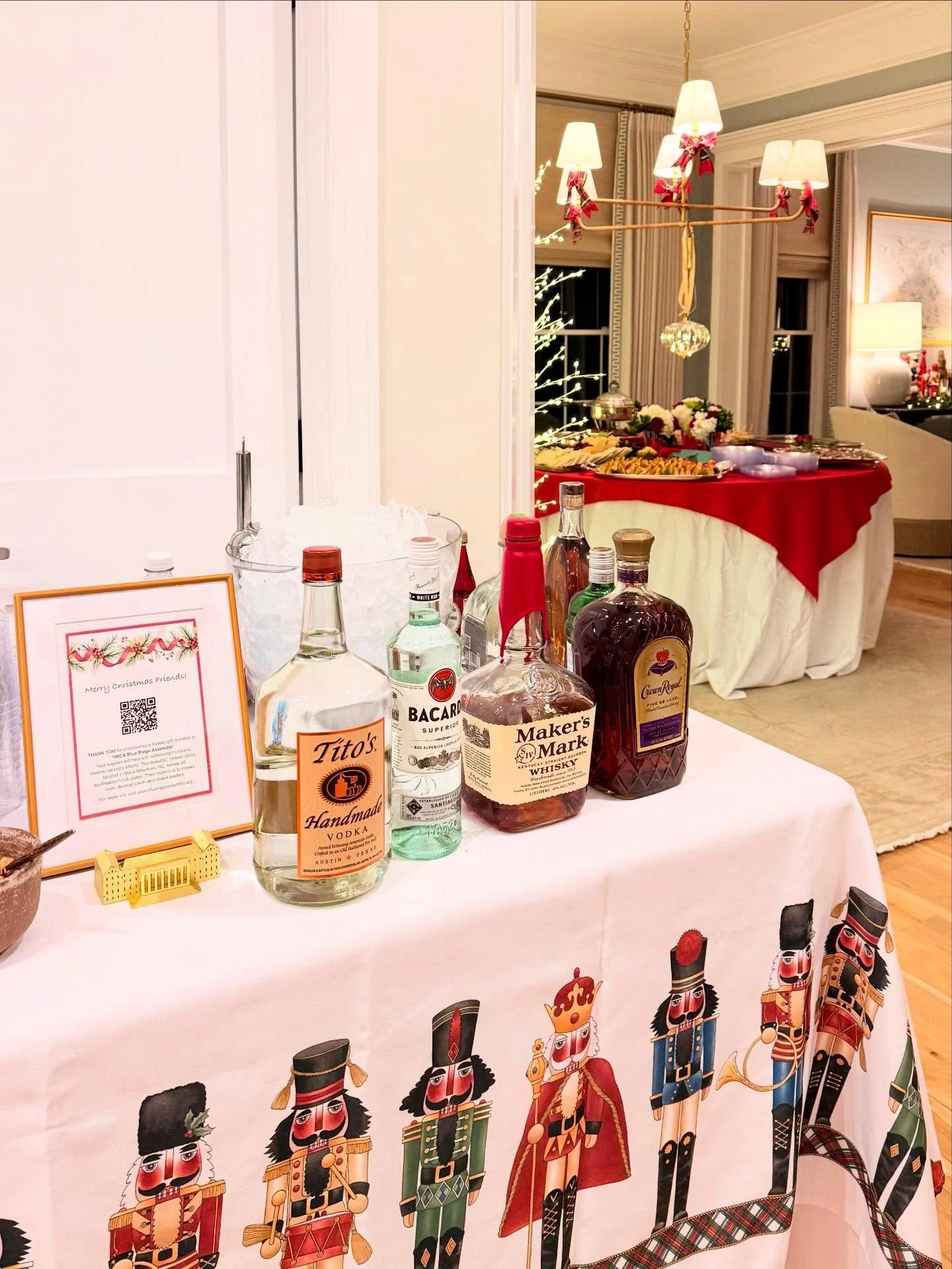 A peek at a corner bar with Nutcrackers lined up ready to be of service. The hostess used the spirit of the season to share her wonderful work with the YMCA Blue Ridge Assembly by having a QR code for guests to join their family in supporting a cause
