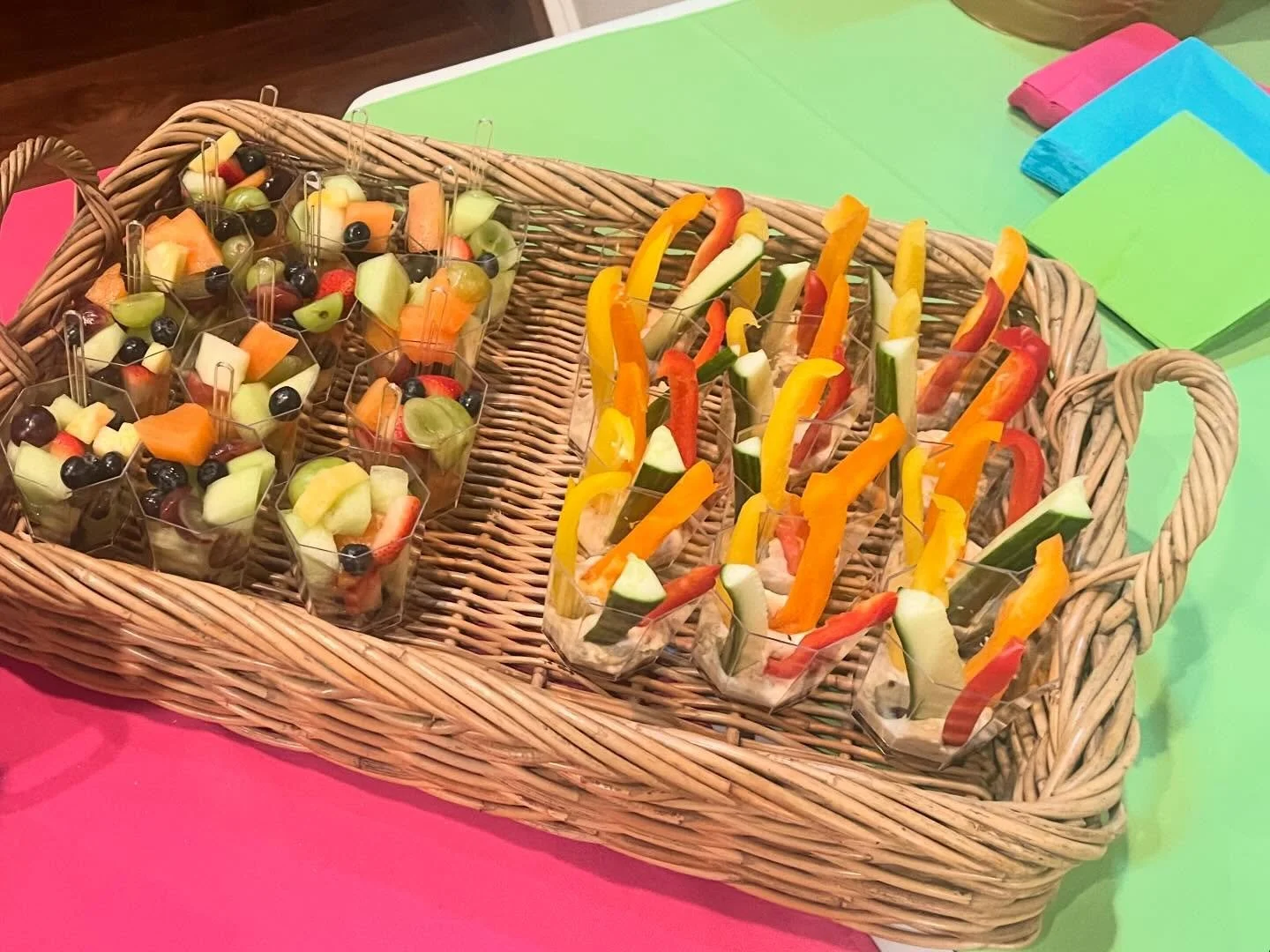 Making a splash at this pool party with grab and go fruit salad and veggies with hummus in little disposable patio cups