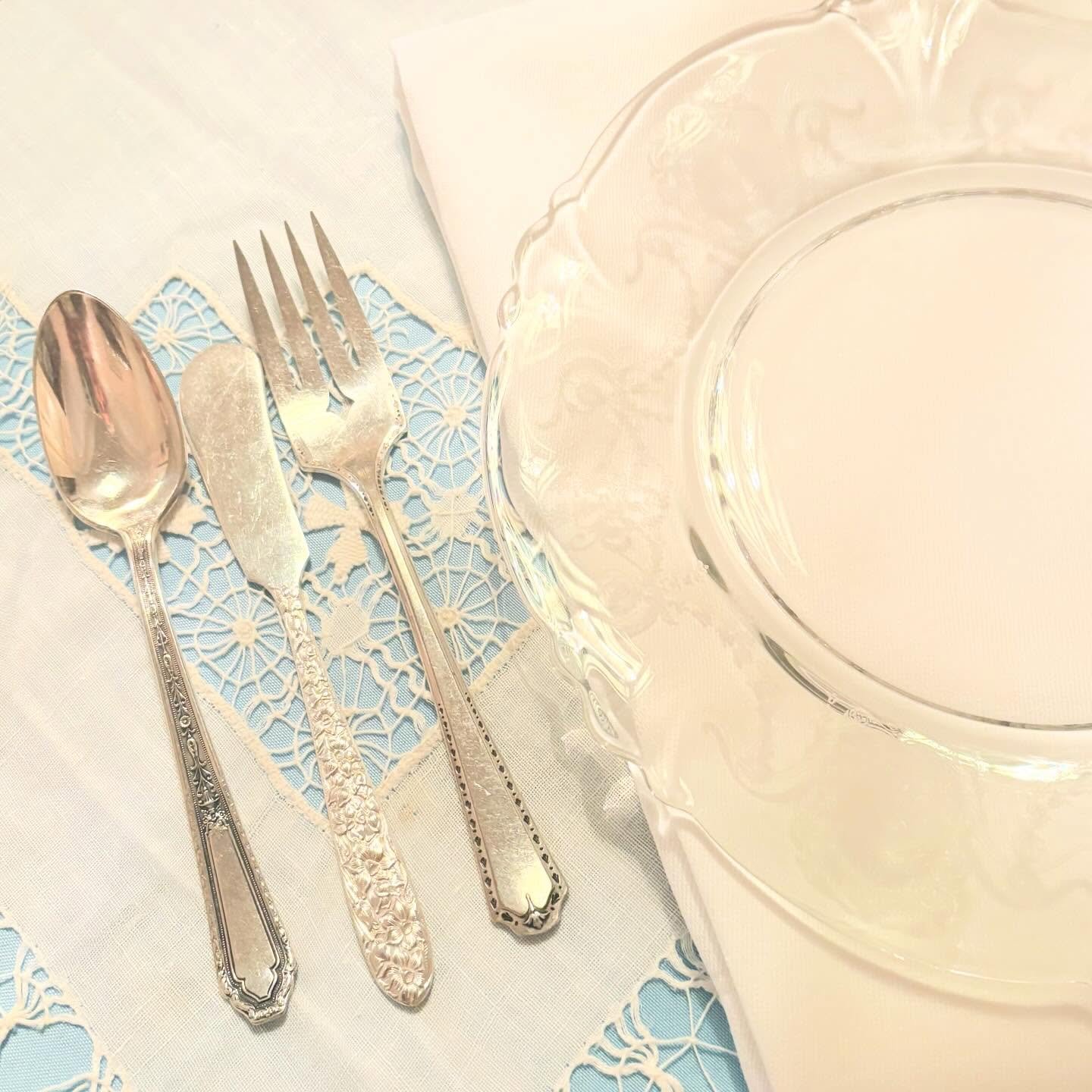 Up close and personal with a tea table place setting for a formal seated three course tea.  Like all place settings, you work from the outside in.  First, you stir milk and sugar in your cup with a teaspoon, second you layer Devon cream and strawberr