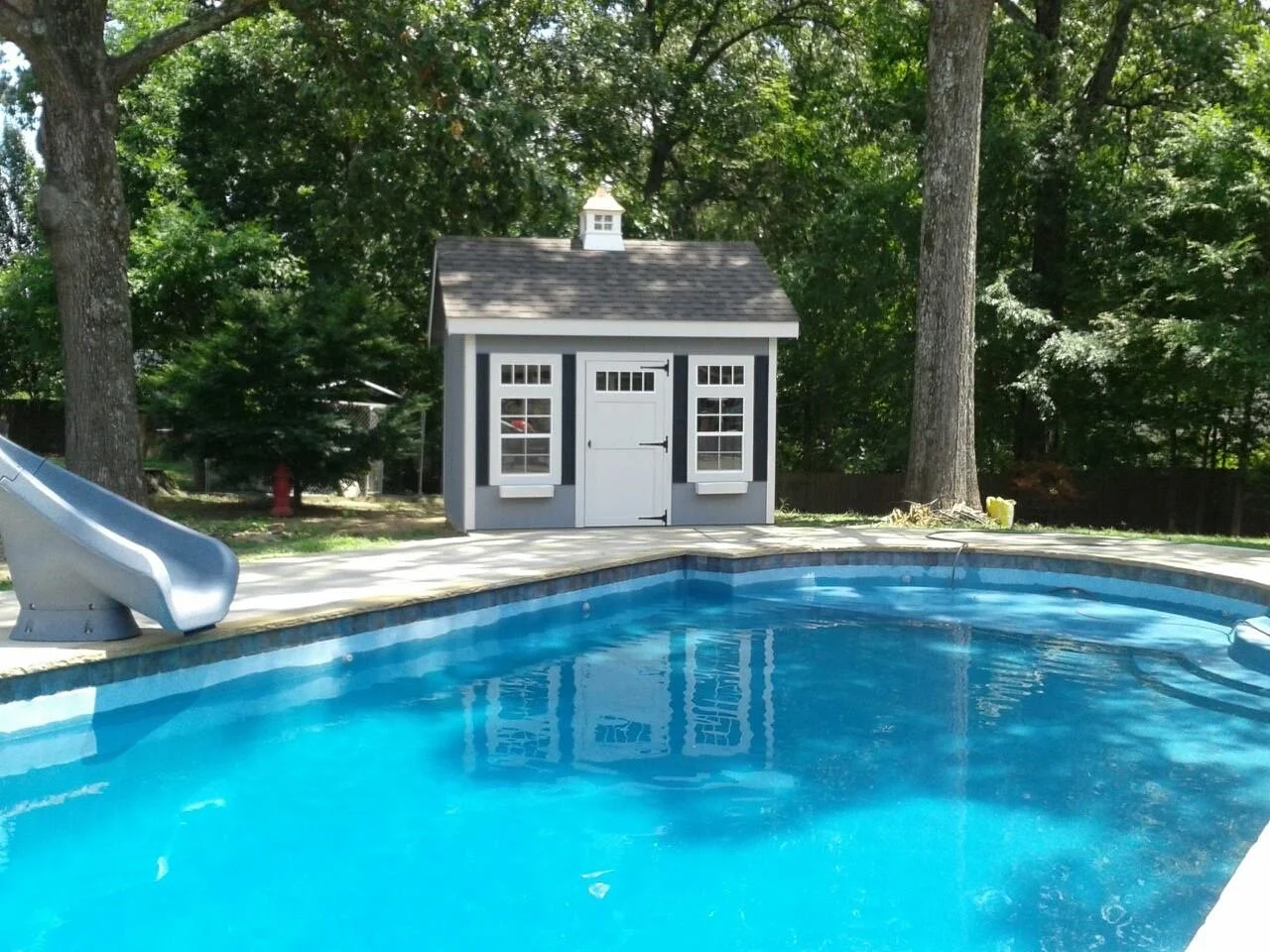 Adams Portable Buildings Playhouse by Pool.jpg