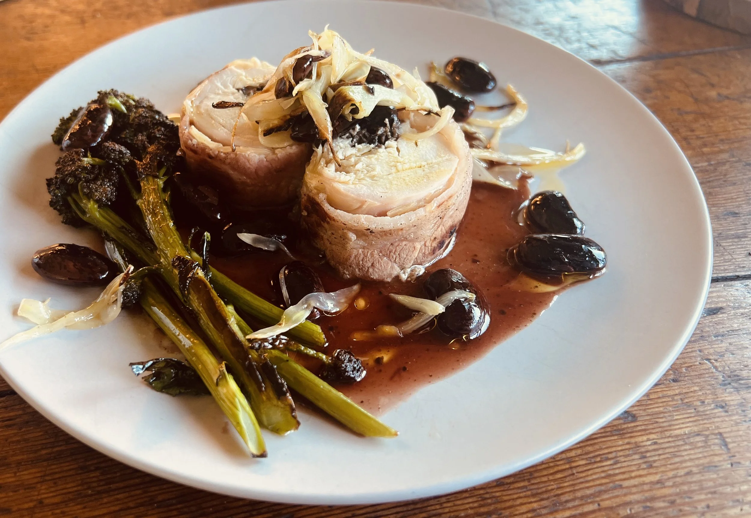Roulade of rabbit loin, scarlet runner bean ragout, purple broccoli rabe. 