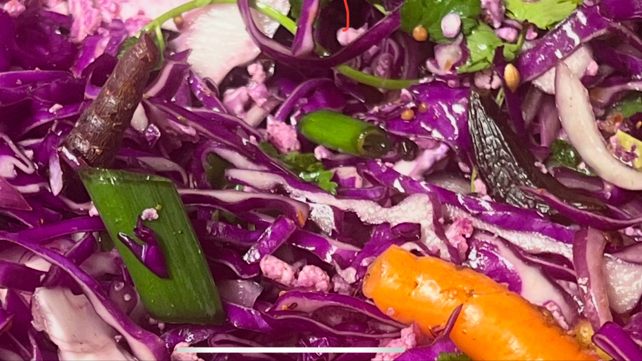 cabbage sauerkraut with rainbow carrots and black garlic