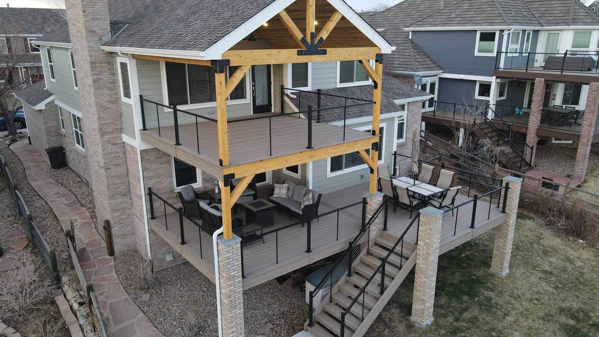 Finished timber-frame covered deck at golden hour, Front Range Colorado