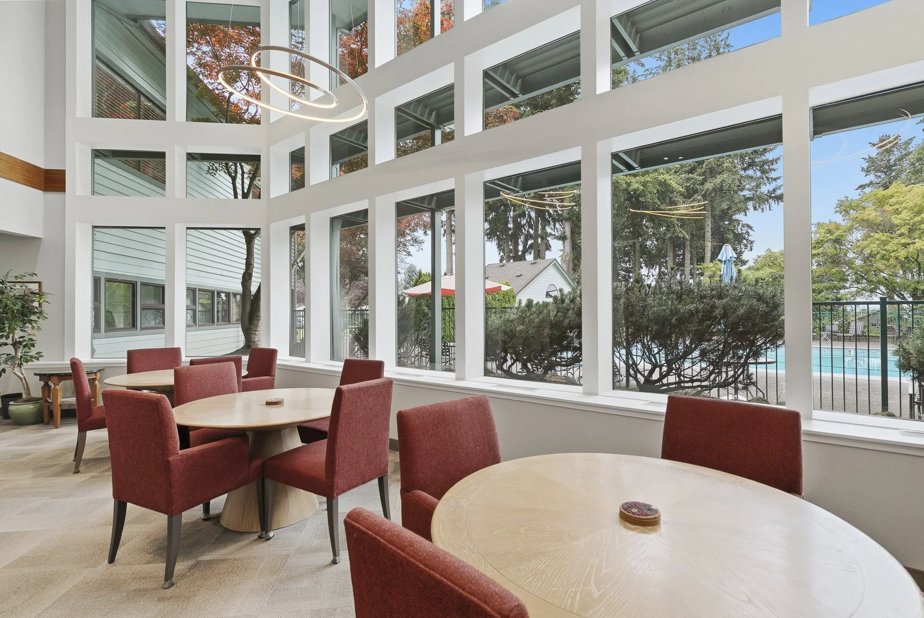 Interior photo of a clubhouse overlooking the pool area in Vancouver, WA