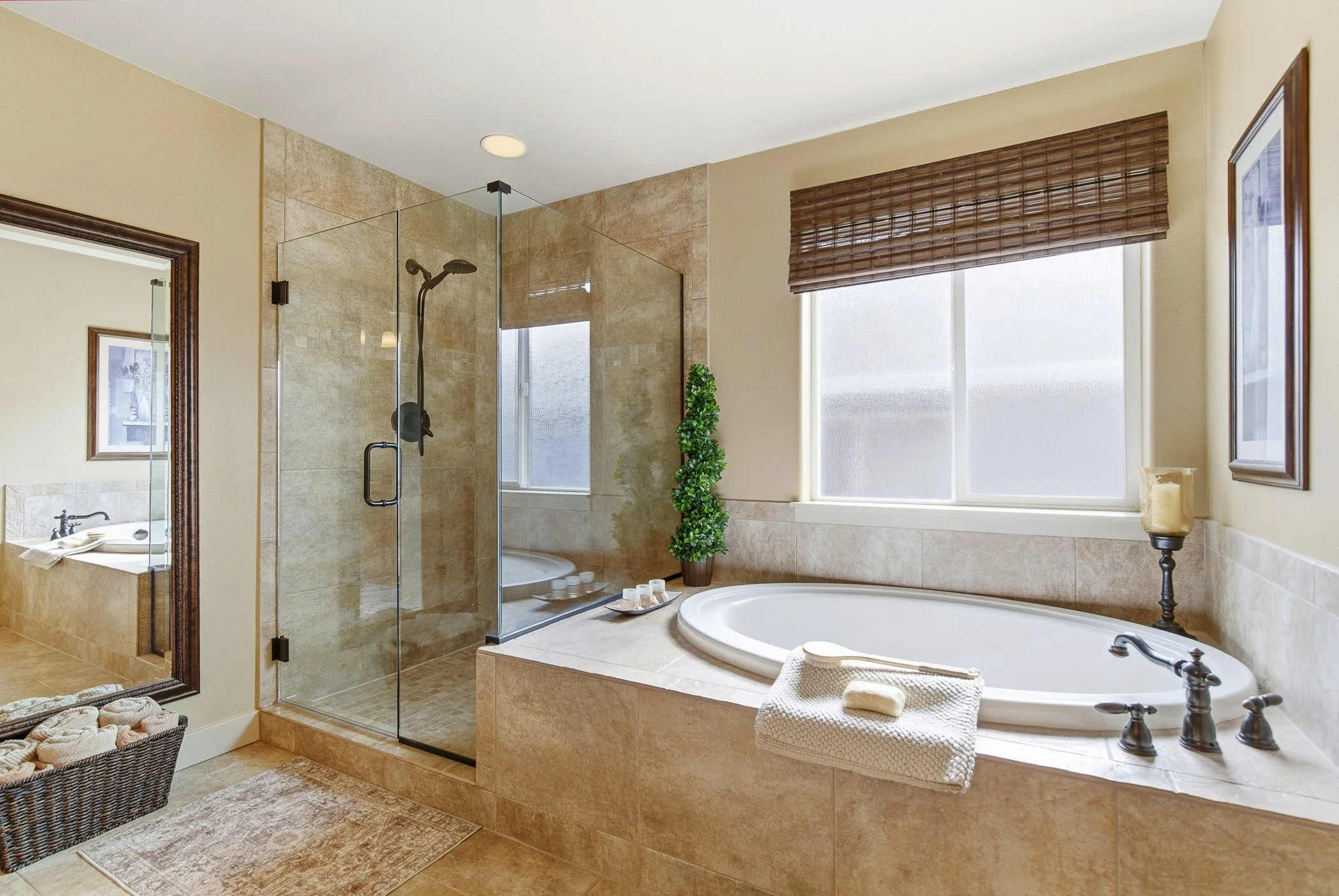 Primary bathroom showcasing a tub and shower imn a luxury home located in Portland, Oregon