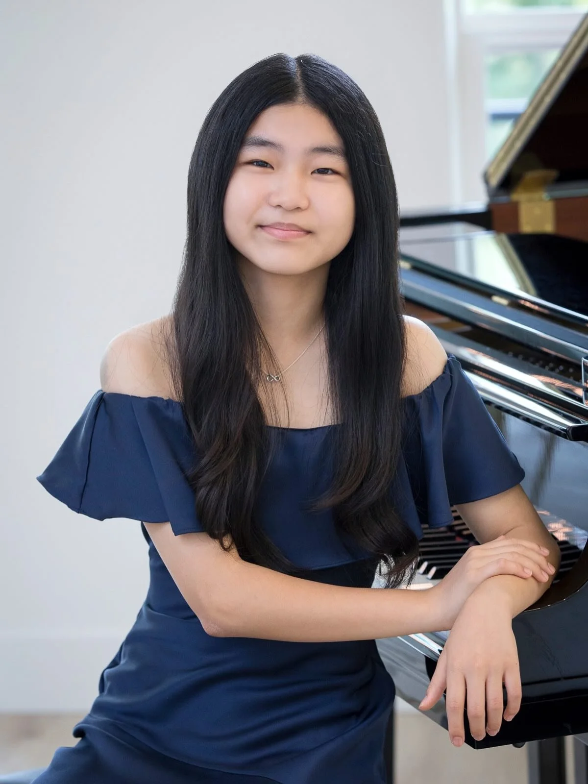 I recently had the opportunity to photograph a remarkable middle school student who is pursuing her passion for both flute and piano. 

These portraits were created to support her upcoming competition submissions and reflect the dedication, personali