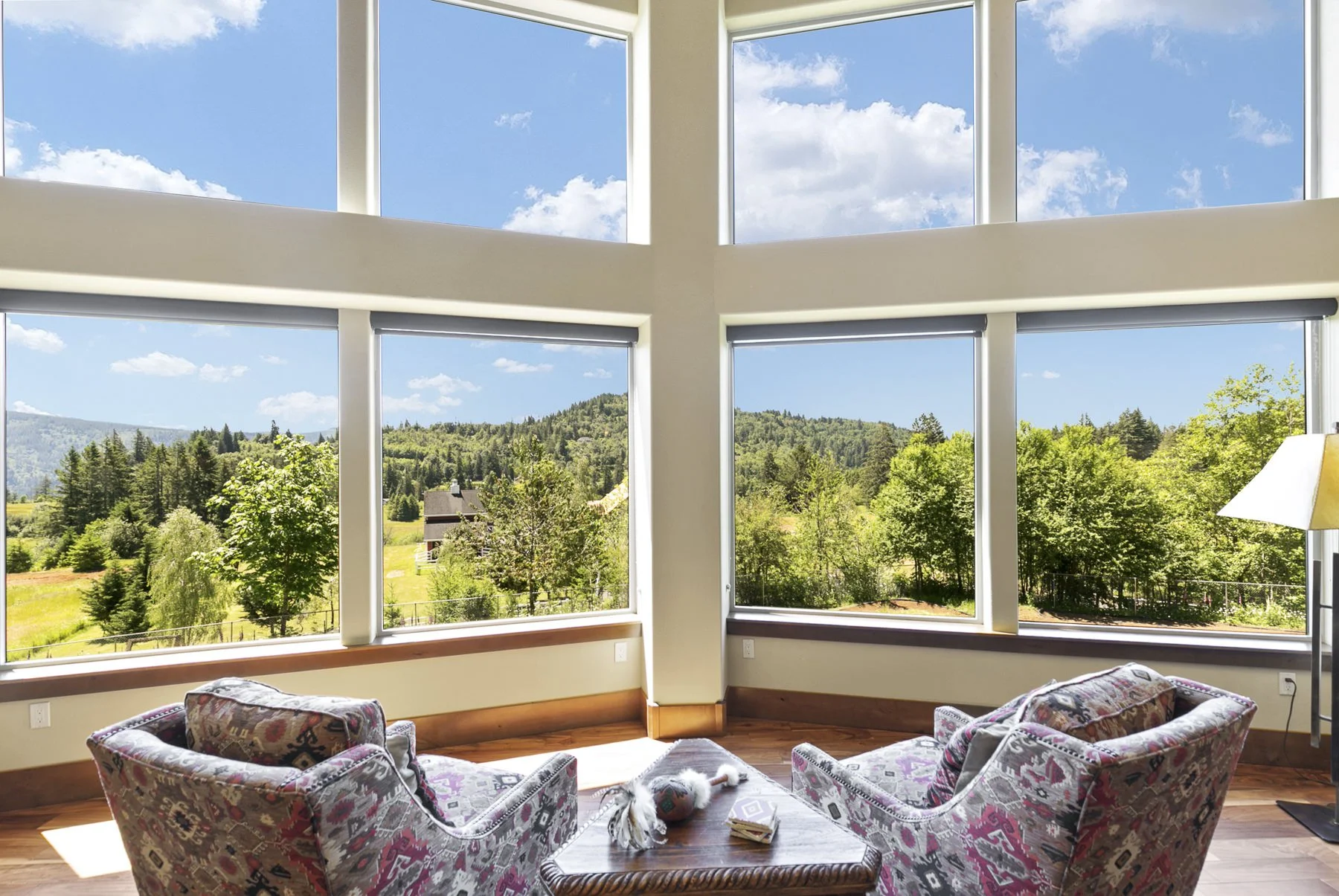 Two chairs in a living room facing a beautiful scenic view overlooking the Columbia River Gorge in Washougal, WA.