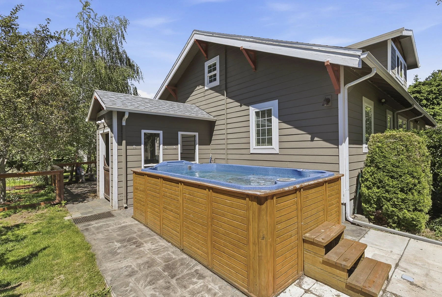 An outdoor swim spa located at a urban homestead in southeast Portland, OR