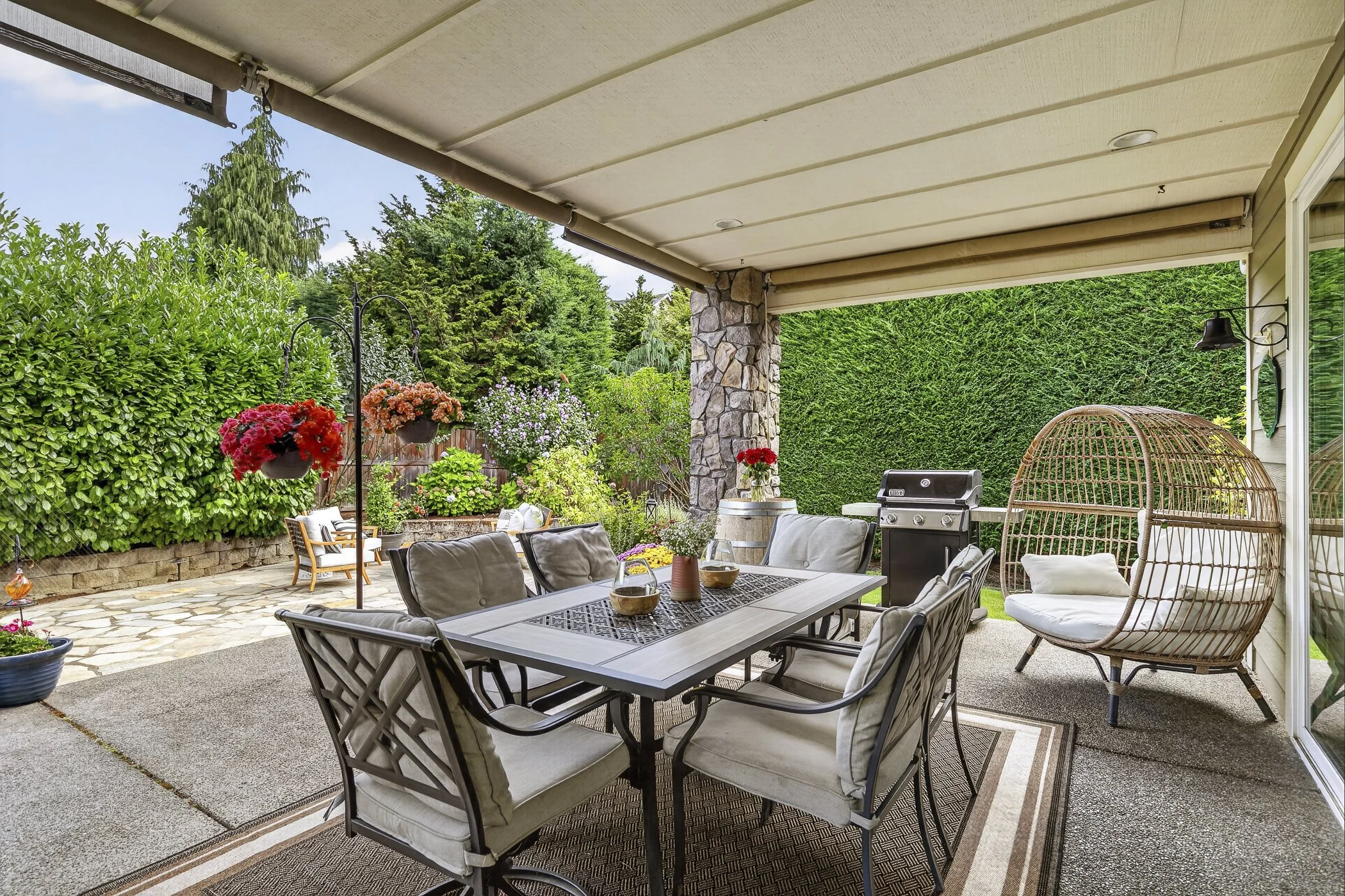 Back patio area overlooking the backyard of a luxury home in Vancouver, WA