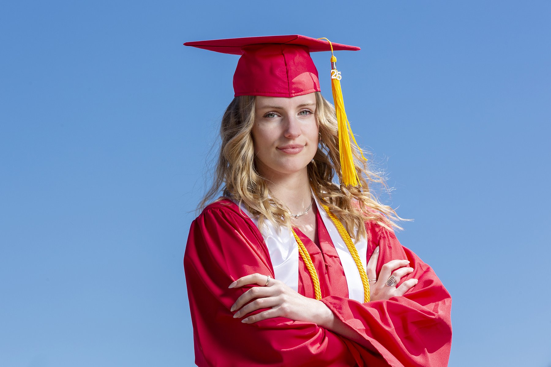 Western Oregon University graduate in cap and gown expressing confidence and determination.