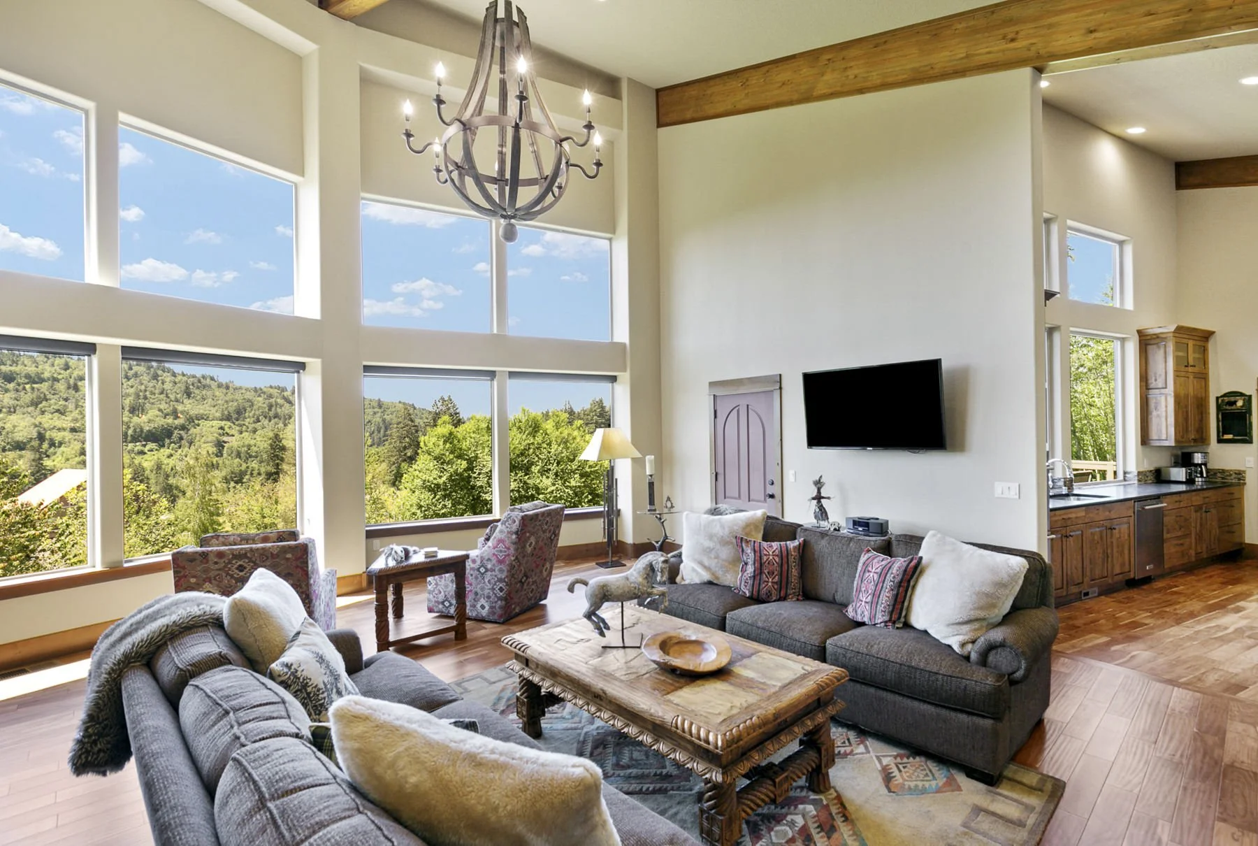Scenic view overlooking the Columbia River Gorge area from the living room in a contemporary lodge-style home.