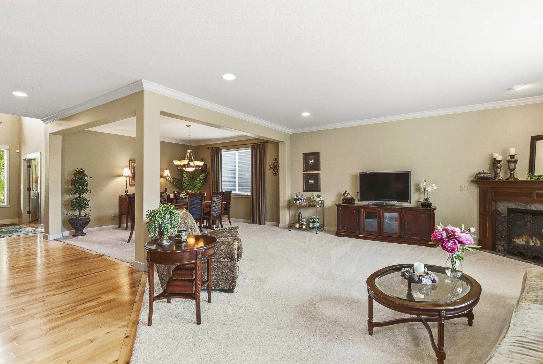 Real estate photo showcasing the open floor layout of the living room and formal dining area in a home located in Portland, Oregon