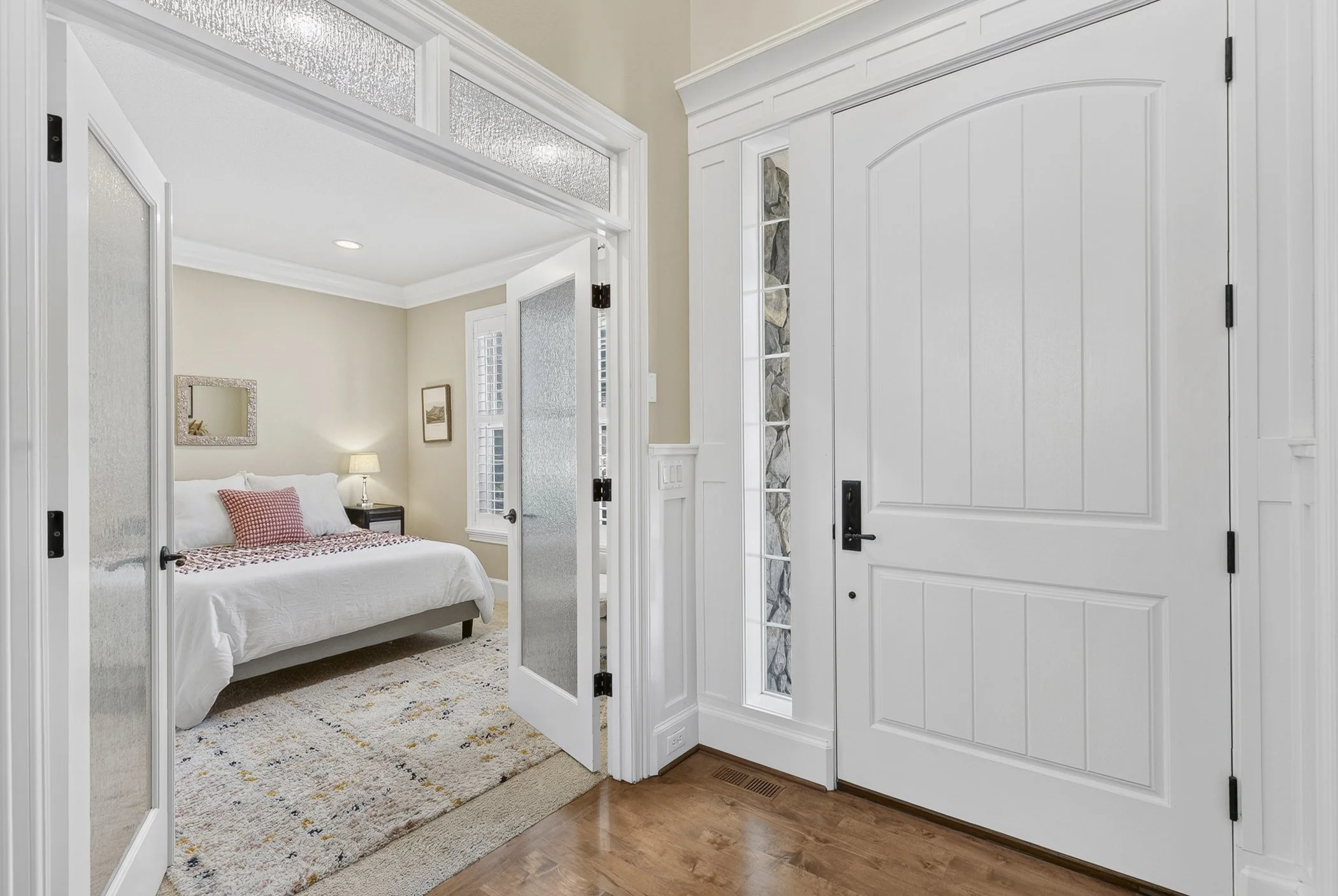 Vancouver, WA luxury home entryway showing french doors leading into a bedroom
