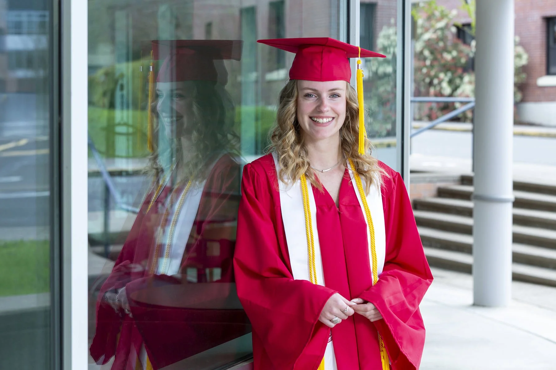Western Oregon University college graduate posing for a professional photo by Paul Rich Studio