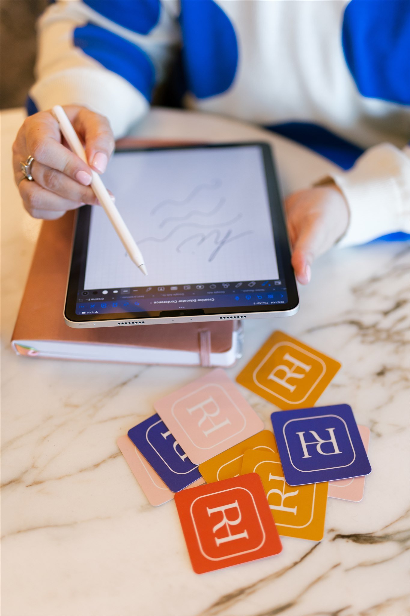 RebeccaHunnicuttPhotographerWorkingAndWritingOnTablet