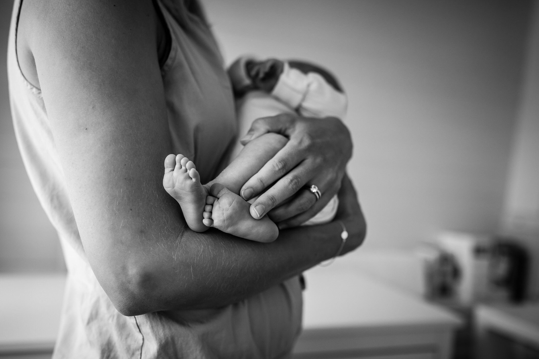 detail image of baby's feet during portland newborn photography lifestyle session.jpg