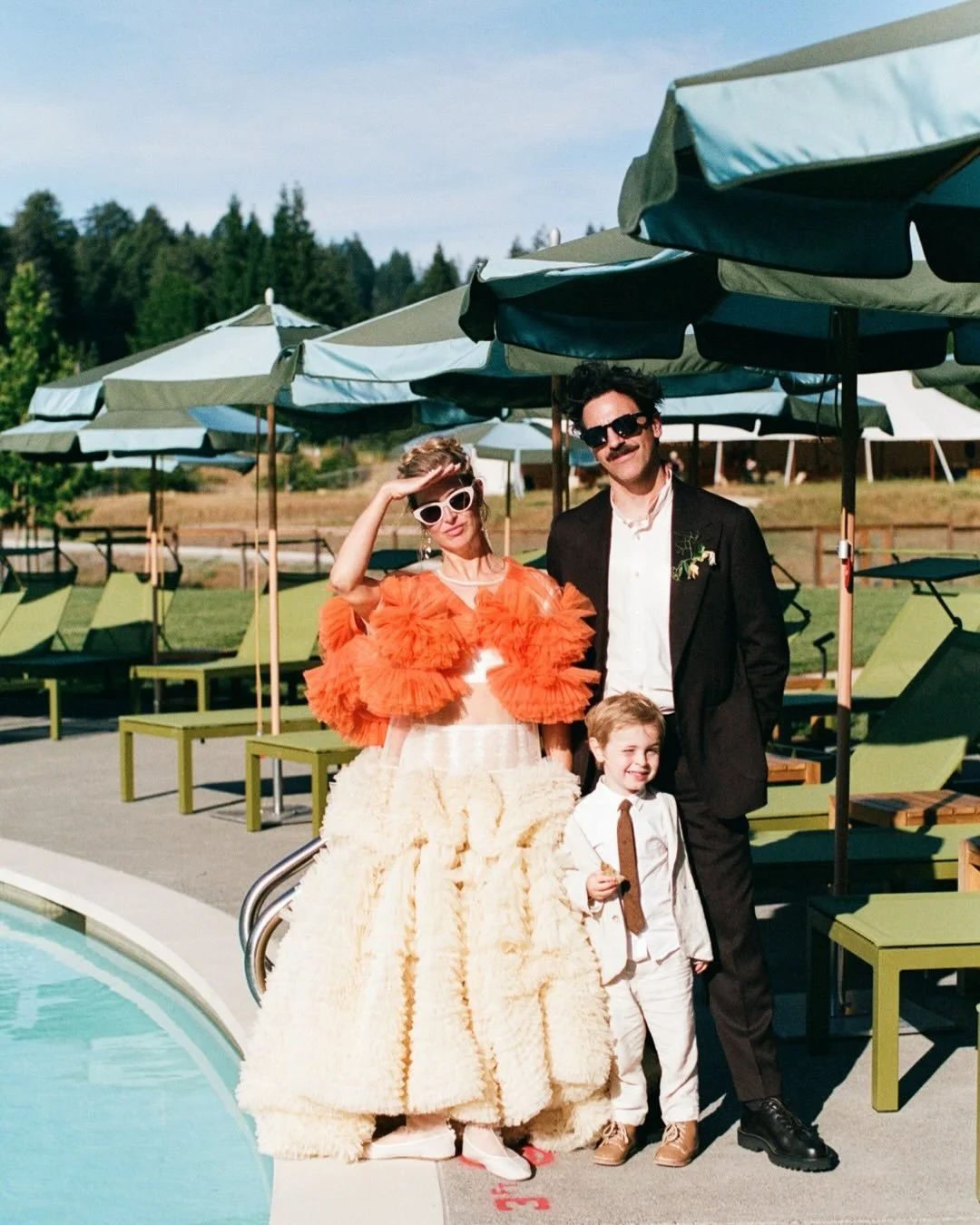 dresses and swimmers and electric love // a little slice of Madeline and Nick&rsquo;s wedding featured on @vogueweddings Her incredible dress is by @mollygoddard , read the @voguemagazine article to hear the story behind it(so good). They got married