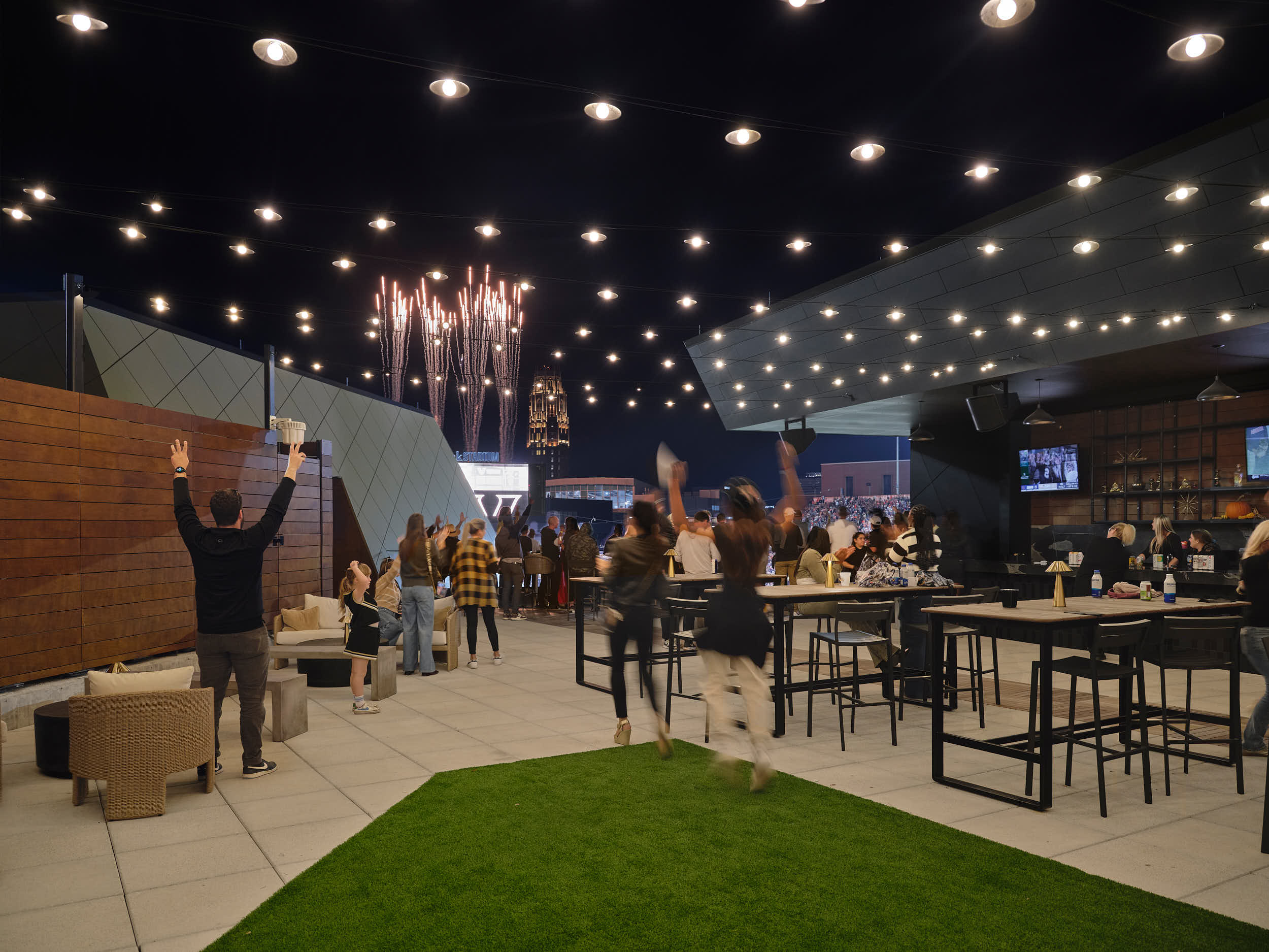 Professional architectural photography of the Vanderbilt FirstBank Stadium South End Zone expansion. Highlights include the Frist Athletics Village, Commodore Suites, and modern SEC stadium design by Populous and Barton Malow