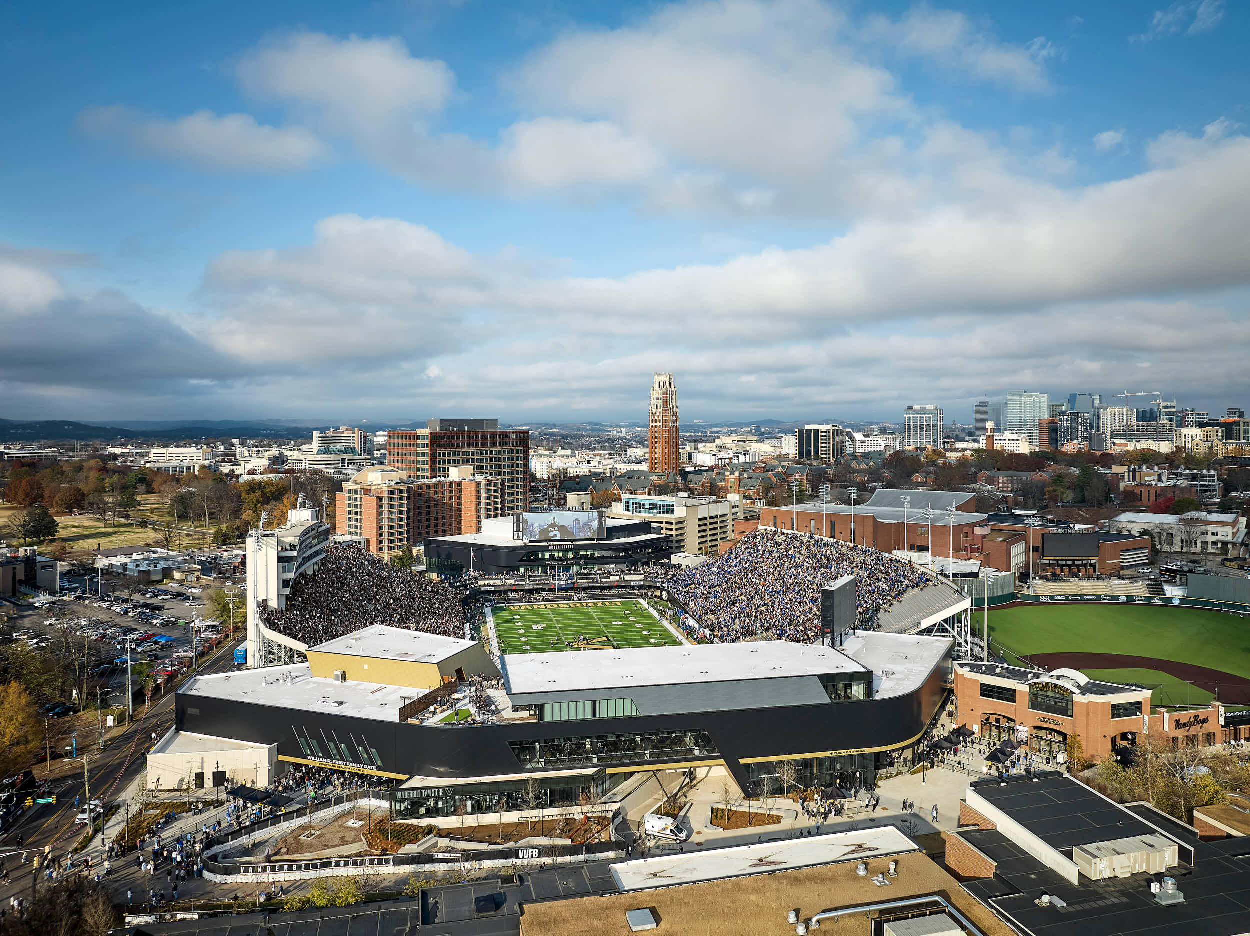 Explore professional architectural photography of the Vanderbilt FirstBank Stadium South End Zone expansion. Highlights include the Frist Athletics Village, Commodore Suites, and modern SEC stadium design by Populous and Barton Malow