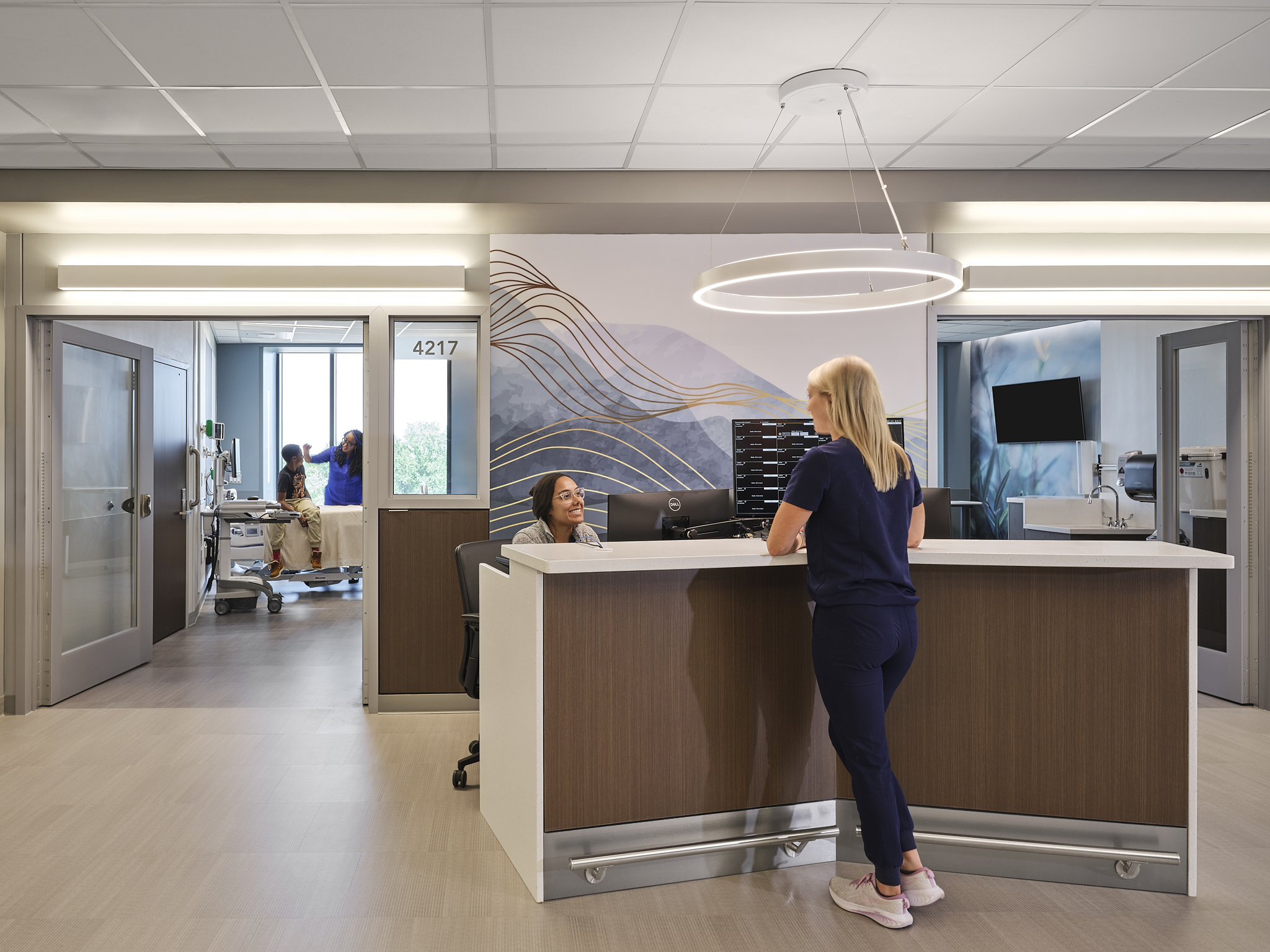 Lake Norman Hospital Nursing Station with open rooms, each floor features evidence based design and cutting edge technology. The Hospital is designed by NBBJ Architects and captured by architectural photographer, Nick McGinn of McGinn Photography