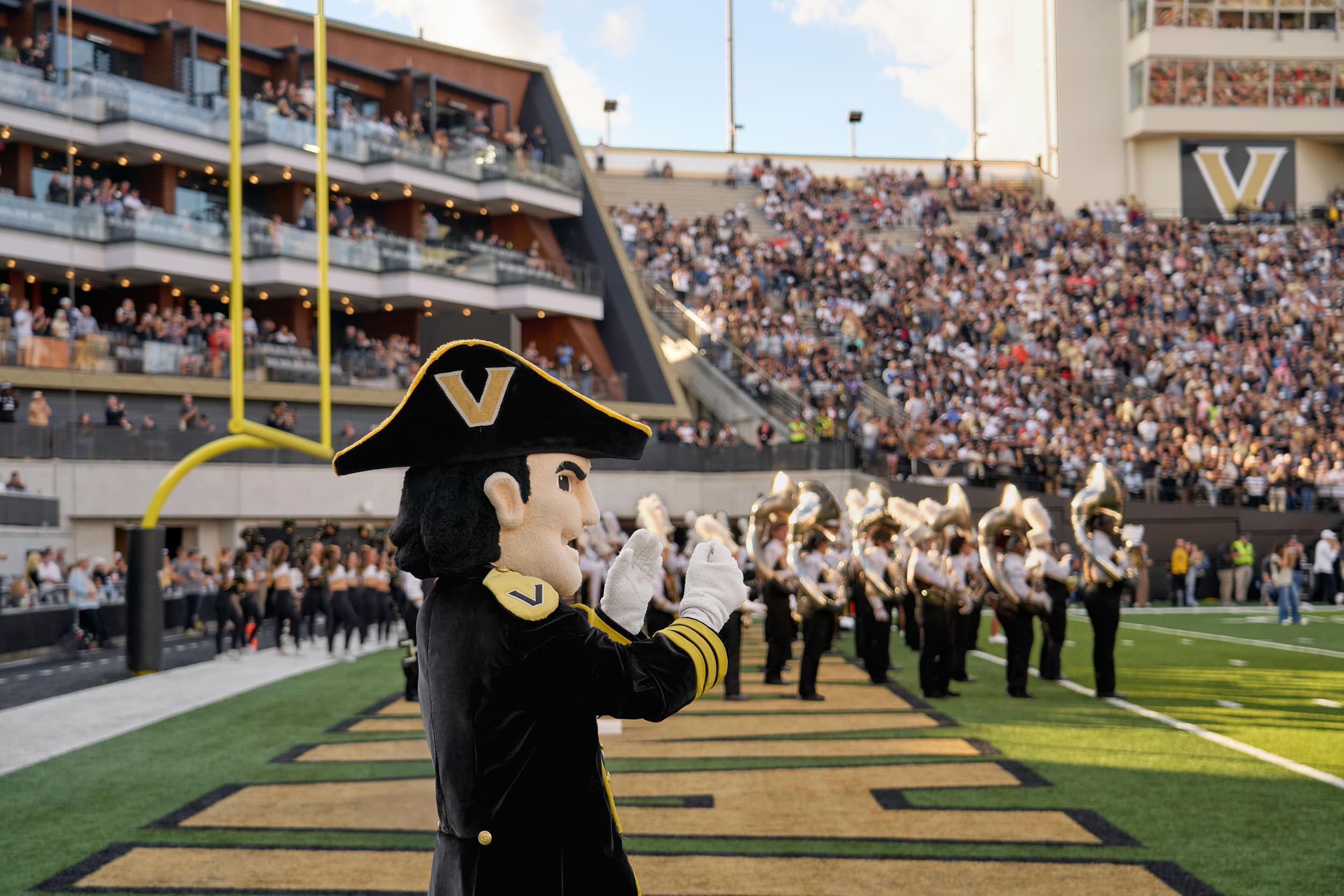 Professional architectural photography of the Vanderbilt FirstBank Stadium South End Zone expansion. Highlights include the Frist Athletics Village, Commodore Suites, and modern SEC stadium design by Populous and Barton Malow
