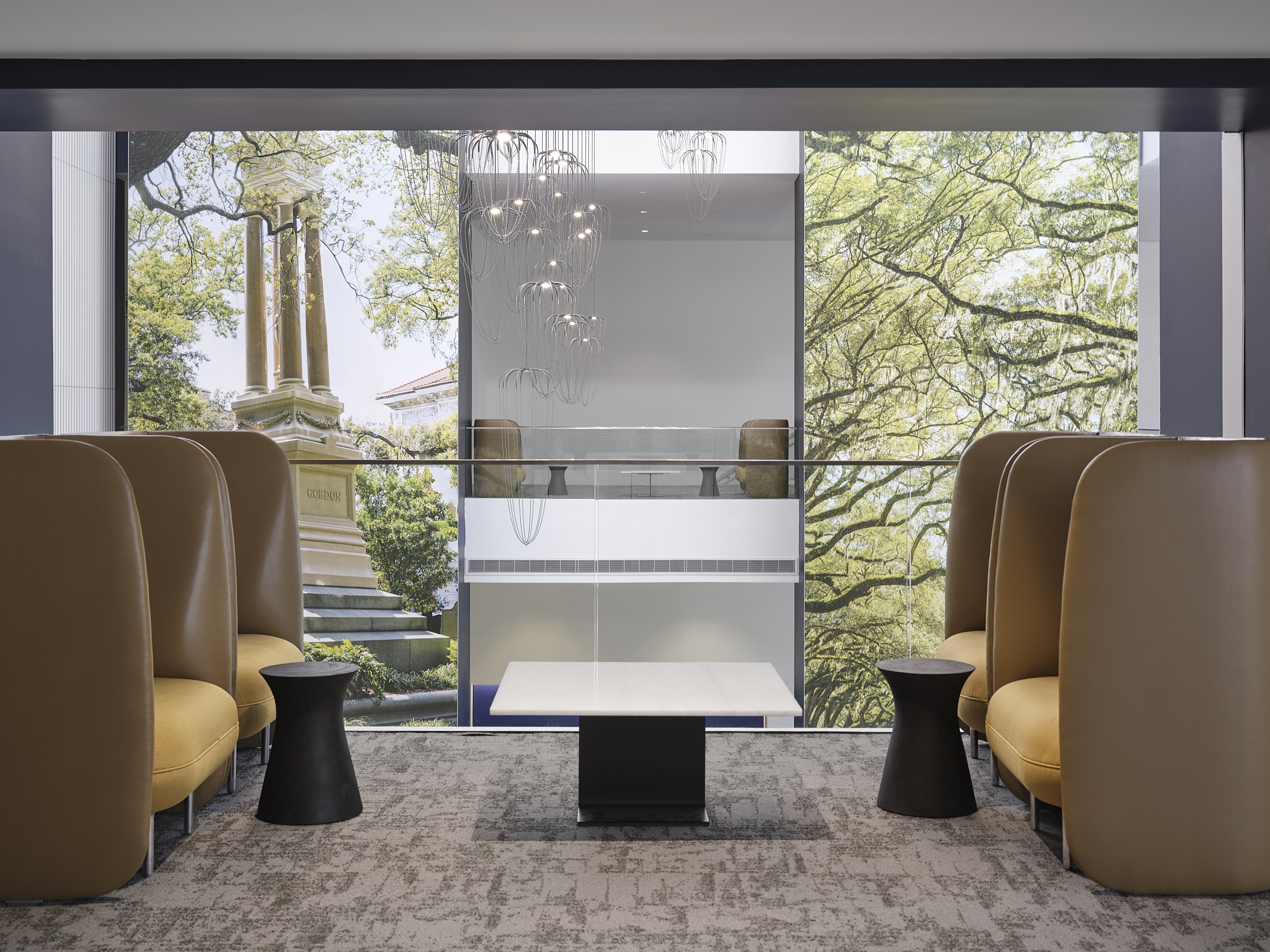 A tight-angle interior architectural photograph of the Savannah Convention Center expansion, showing the seating on the second floor