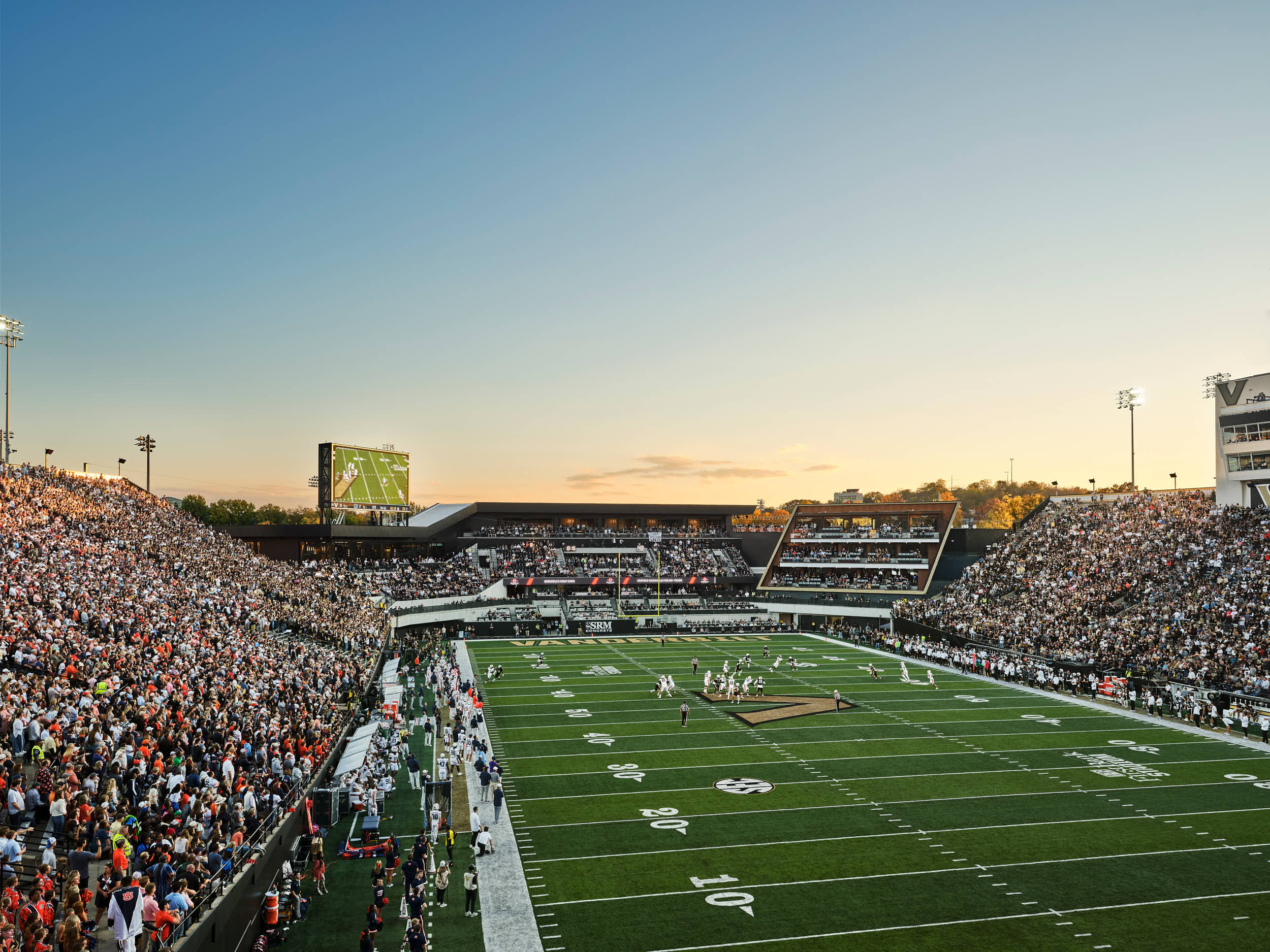 Explore professional architectural photography of the Vanderbilt FirstBank Stadium South End Zone expansion. Highlights include the Frist Athletics Village, Commodore Suites, and modern SEC stadium design by Populous and Barton Malow