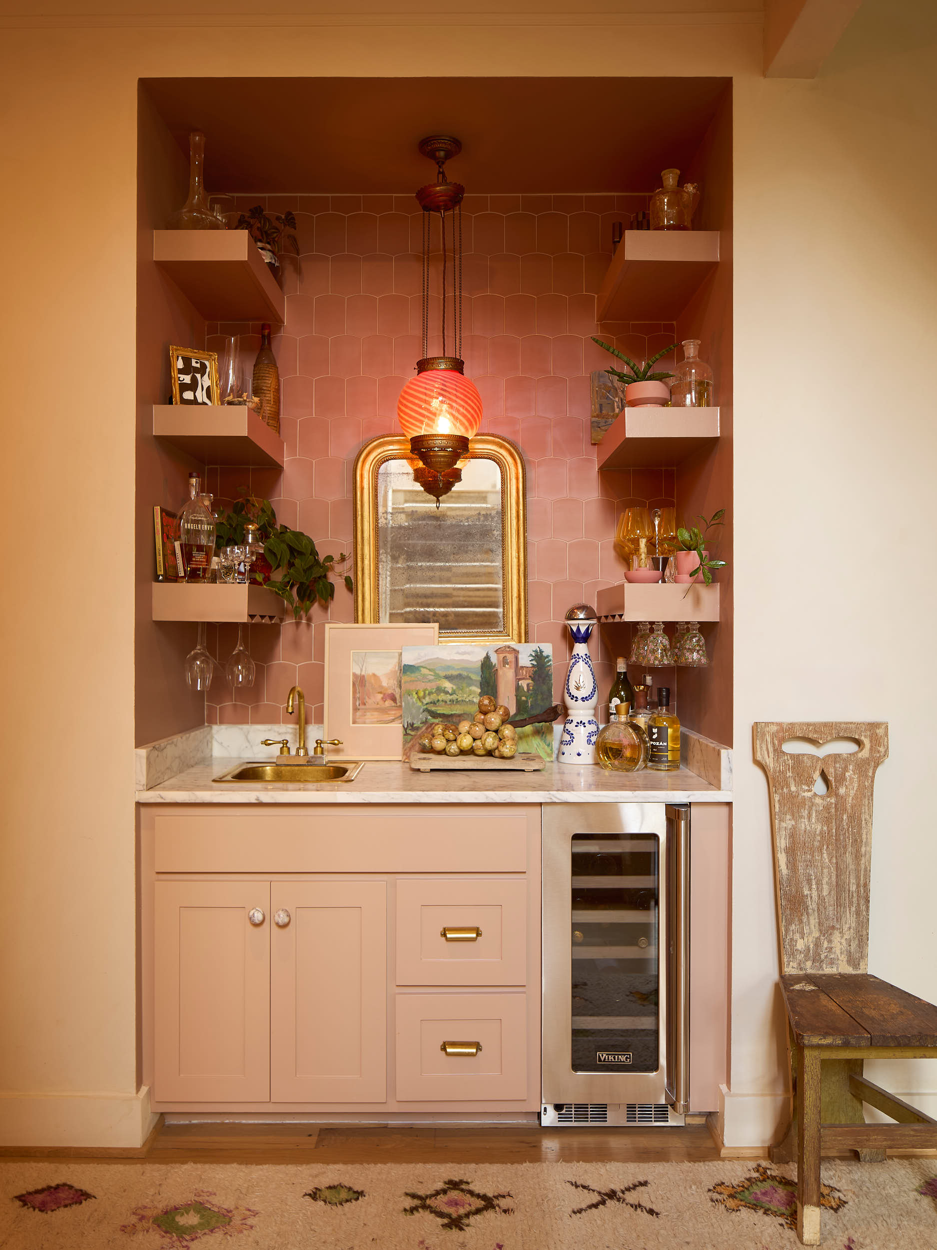This sophisticated custom wet bar is a standout feature in our latest Nashville celebrity home shoot for Branan White Interior Design. The niche is defined by a stunning terracotta picket tile backsplash and tonal floating shelves, creating a seamles