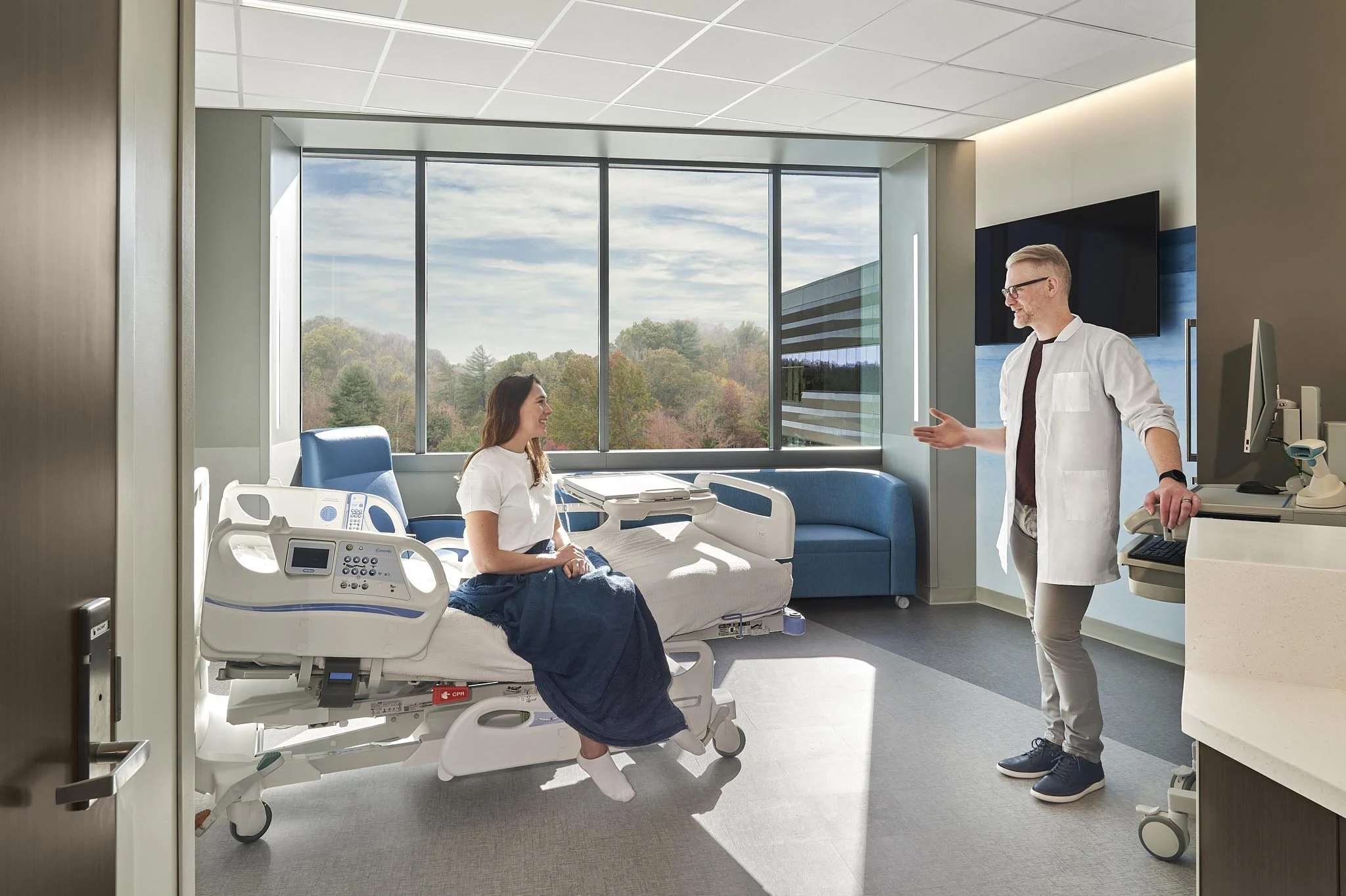 Doctor consulting with a patient in a modern healthcare facility