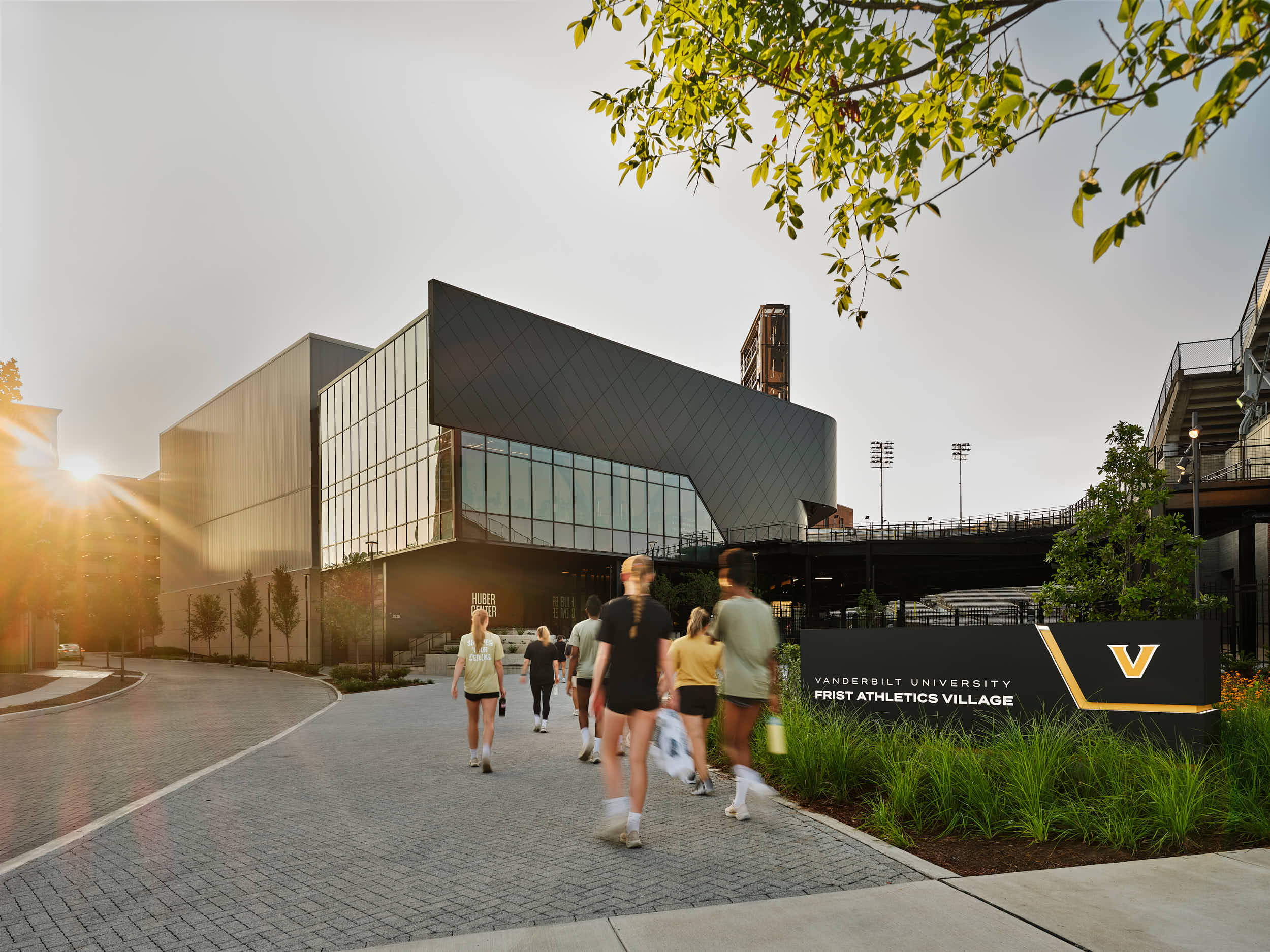 Wide-angle architectural shot of the glass entrance at the Vanderbilt Women's Basketball facility at dusk, Nashville photographed by Nashville's best architectural photographer, mcginn photography.