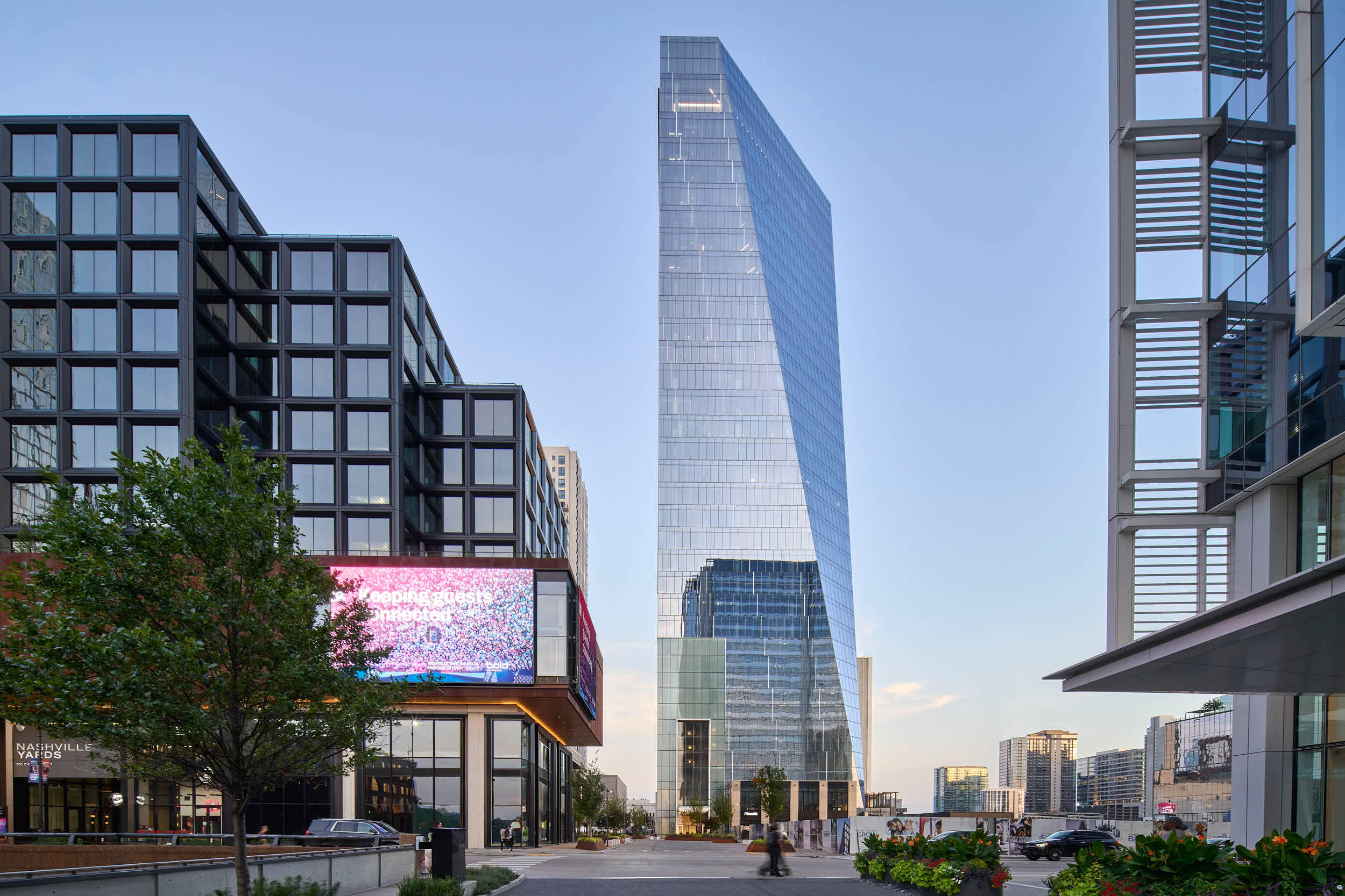 Architectural exterior shot of Nashville Yards office towers and green space at sunset, photographed by Nick McGinn