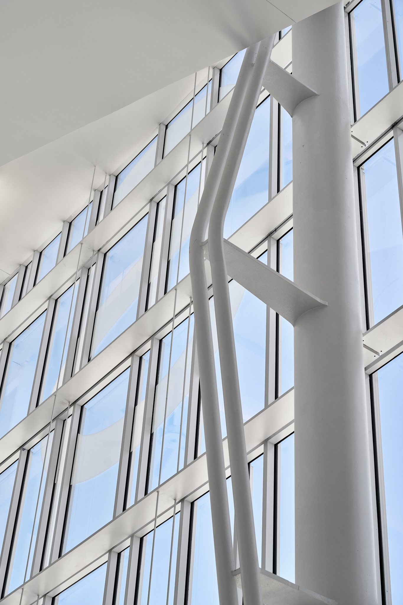 A tight-angle detail architectural photograph of the Savannah Convention Center showing the glass facade