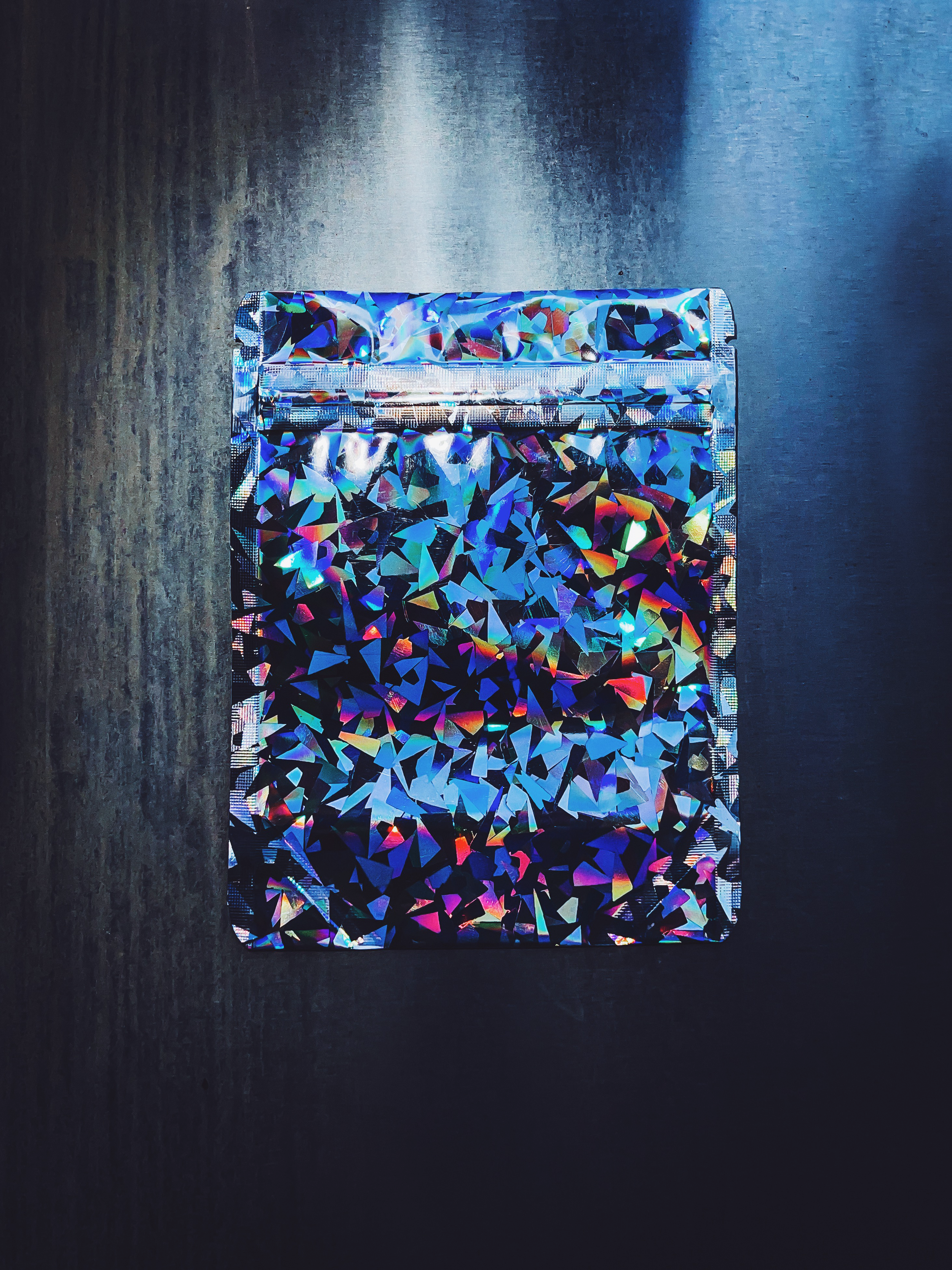 4x5in Crystal Holographic bag on metallic background.