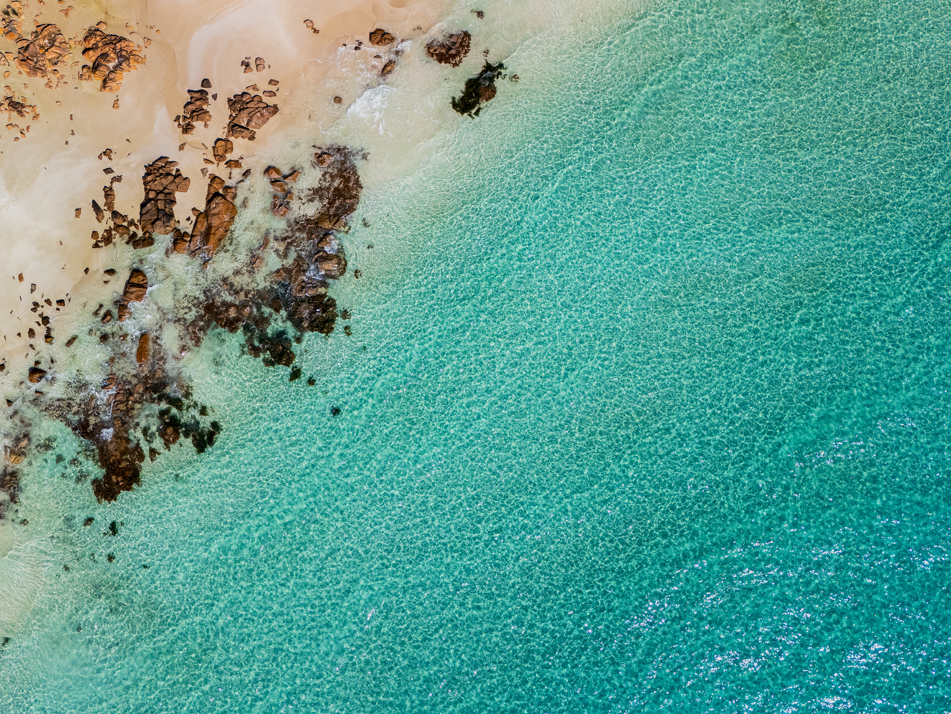 An aerial photograph of a turquiose beach in Dunsborough Western Australia