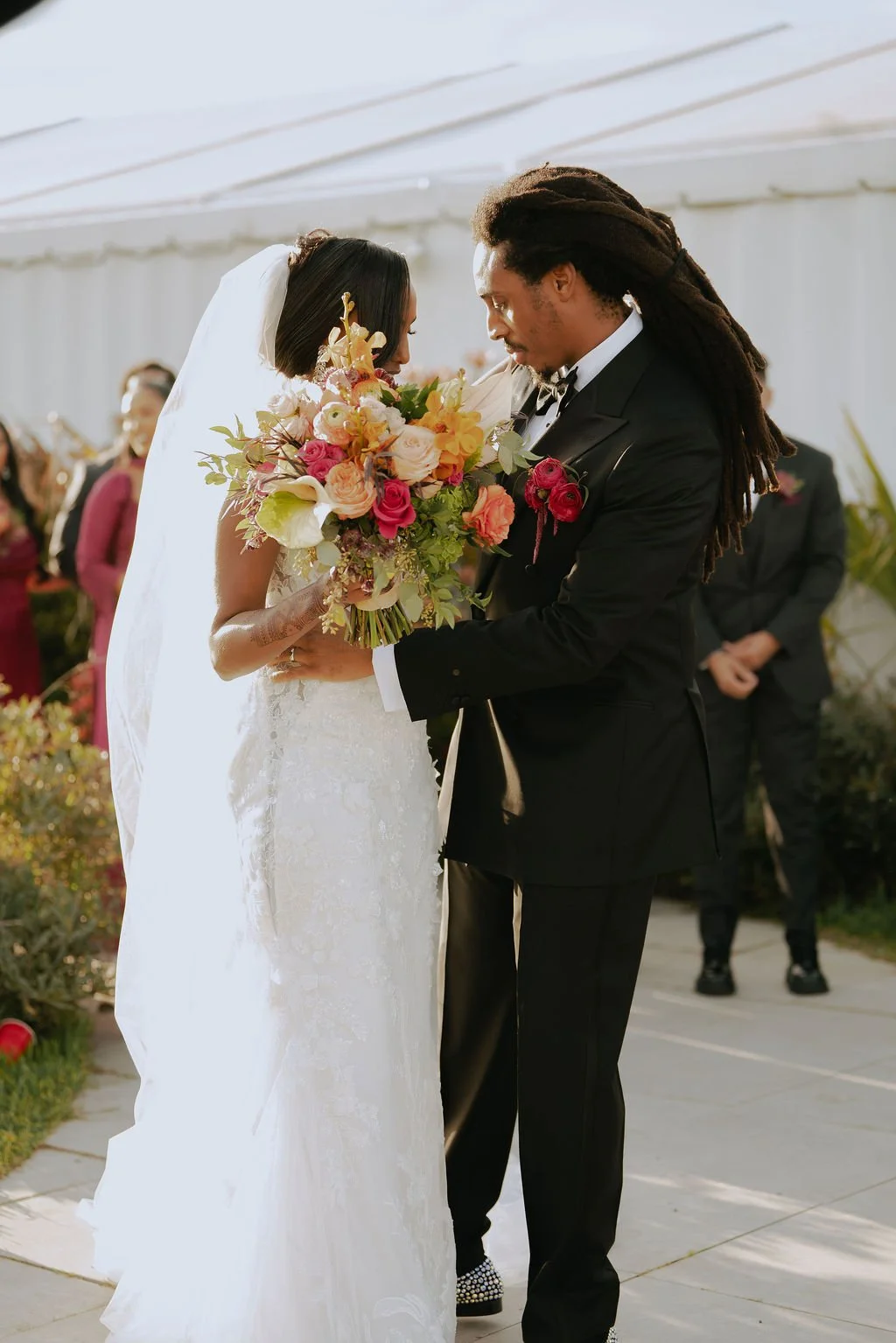 Bold Skyline Events SF wedding with rich deep raspberry, olive green, orange, burgundy, and pink wedding flowers. Featuring striking bridal and bridesmaid bouquets, ceremony florals, colorful reception centerpieces, lush aisle arrangements, and premi