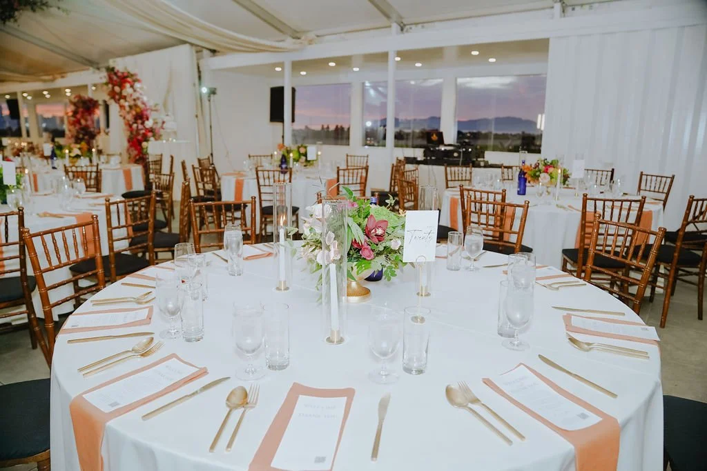 Bold Skyline Events SF wedding with rich deep raspberry, olive green, orange, burgundy, and pink wedding flowers. Featuring striking bridal and bridesmaid bouquets, ceremony florals, colorful reception centerpieces, lush aisle arrangements, and premi