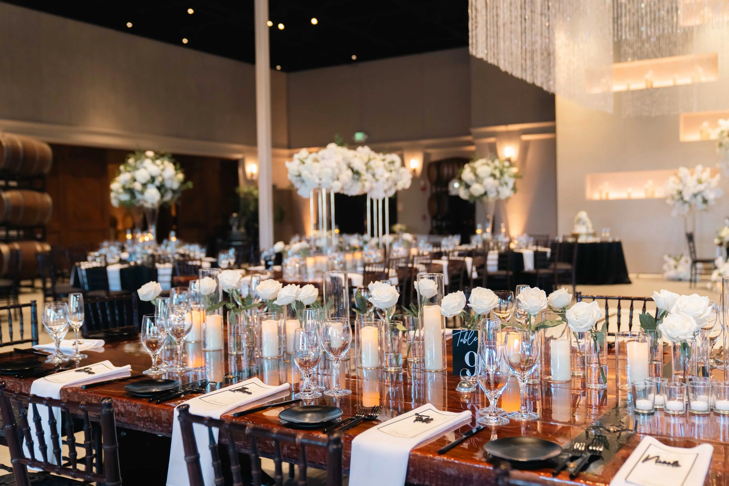 Lush white floral arrangements paired with glowing candles created a romantic, timeless setting for Erika & Javier’s wedding at Palm Event Center. Each bouquet and centerpiece was designed to reflect the couple’s classic style while enhancing the ven