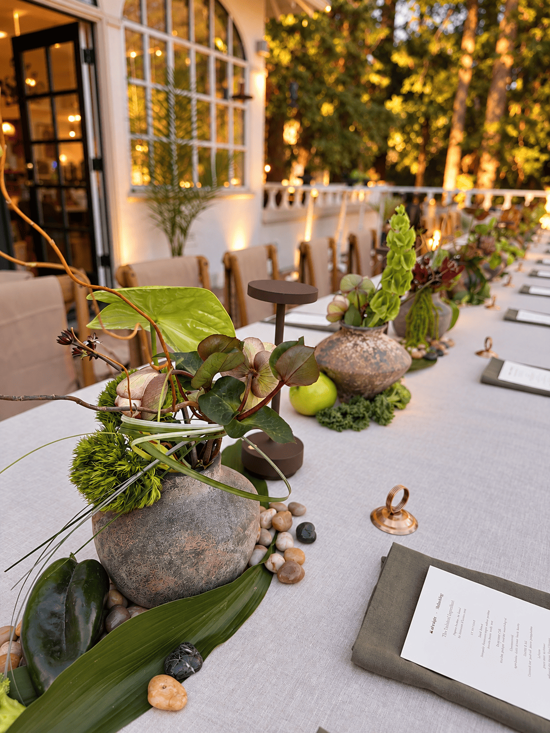 Contemporary corporate event floral design for Methodology, featuring artistic, sculptural arrangements with lush greenery, premium blooms, and unexpected botanical elements. A modern, organic, garden-inspired approach to corporate event florals in S
