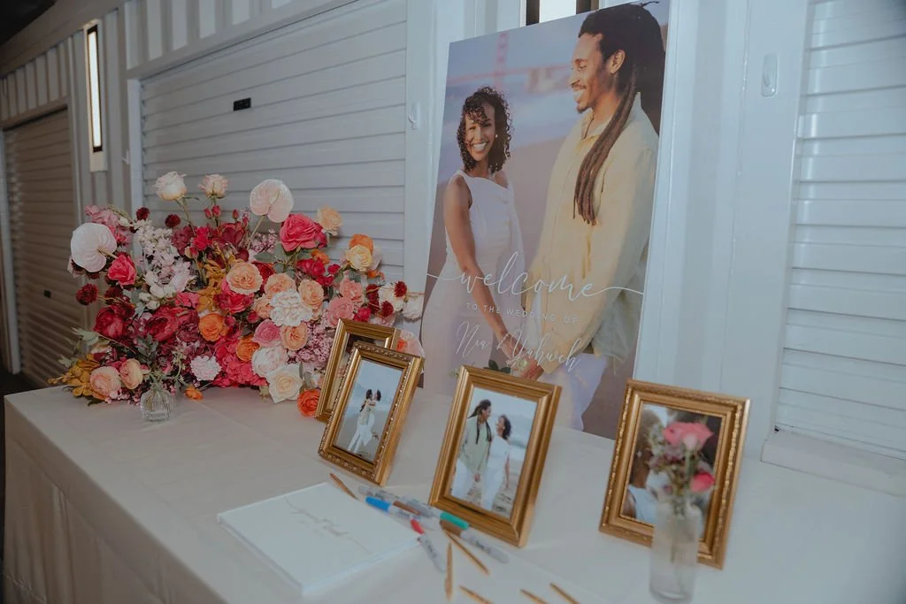 Bold Skyline Events SF wedding with rich deep raspberry, olive green, orange, burgundy, and pink wedding flowers. Featuring striking bridal and bridesmaid bouquets, ceremony florals, colorful reception centerpieces, lush aisle arrangements, and premi